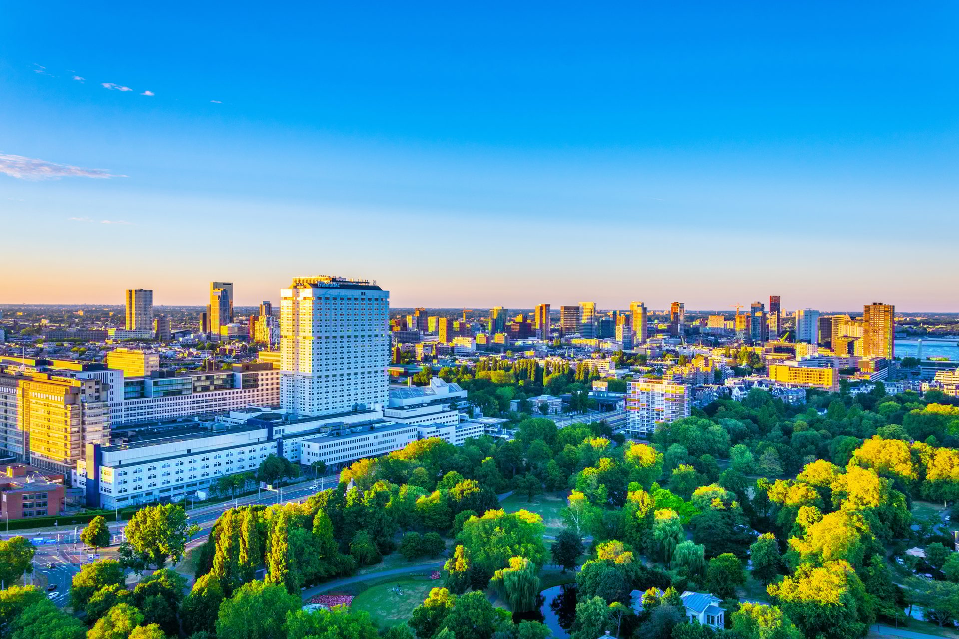 Natural landscape, Tower block, Urban design, Building, Sky, Skyscraper, Nature, Blue, Azure, Plant