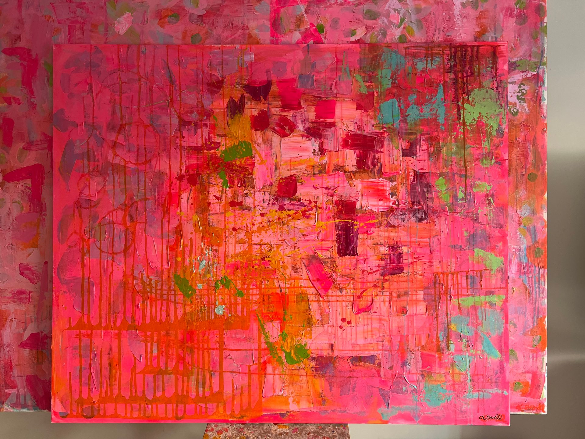 Abstract painting, mostly hot pink, with textured layers, drips, and bright colorful accents.