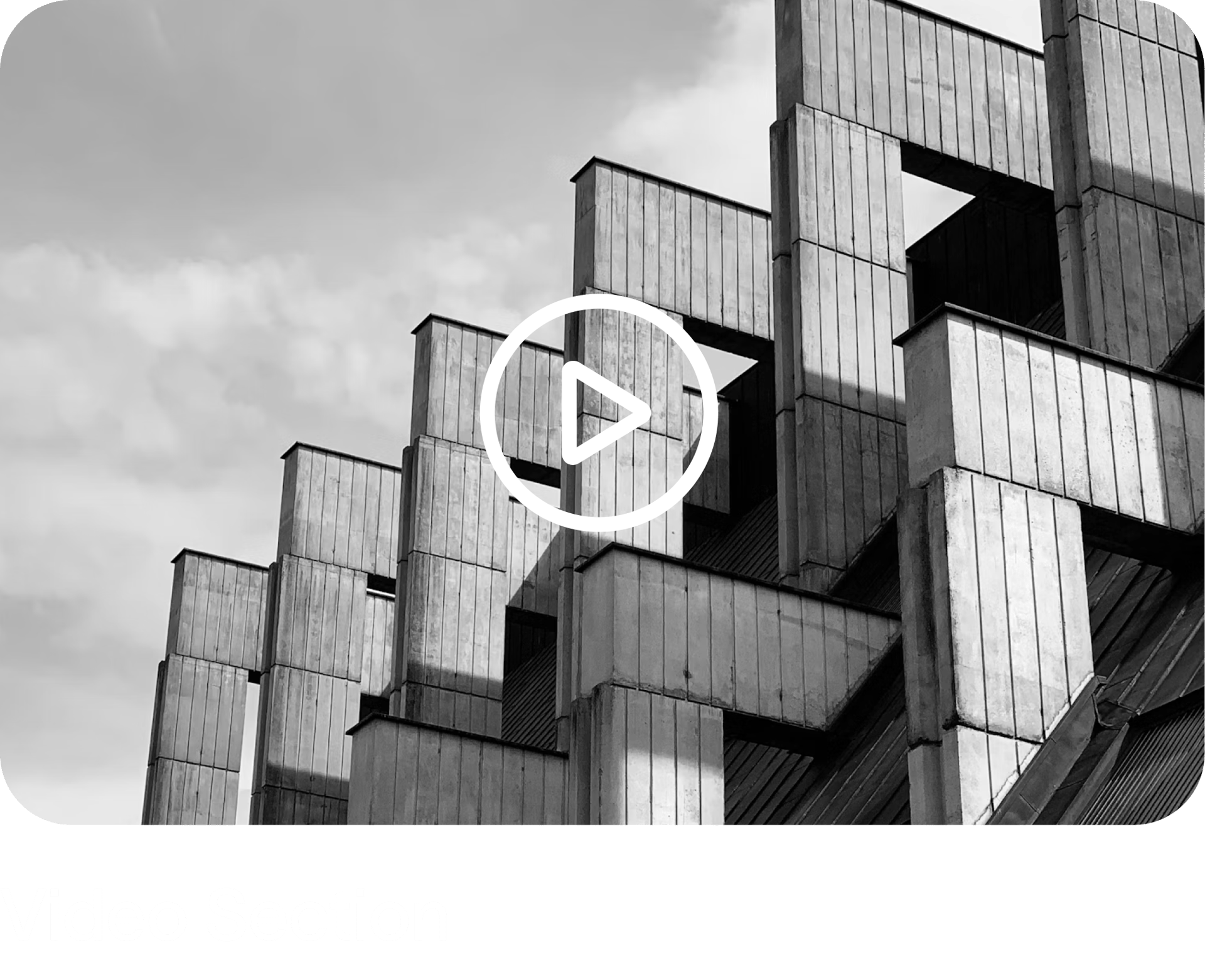 Black and white brutalist building with a play button overlay and "Video Section" text.