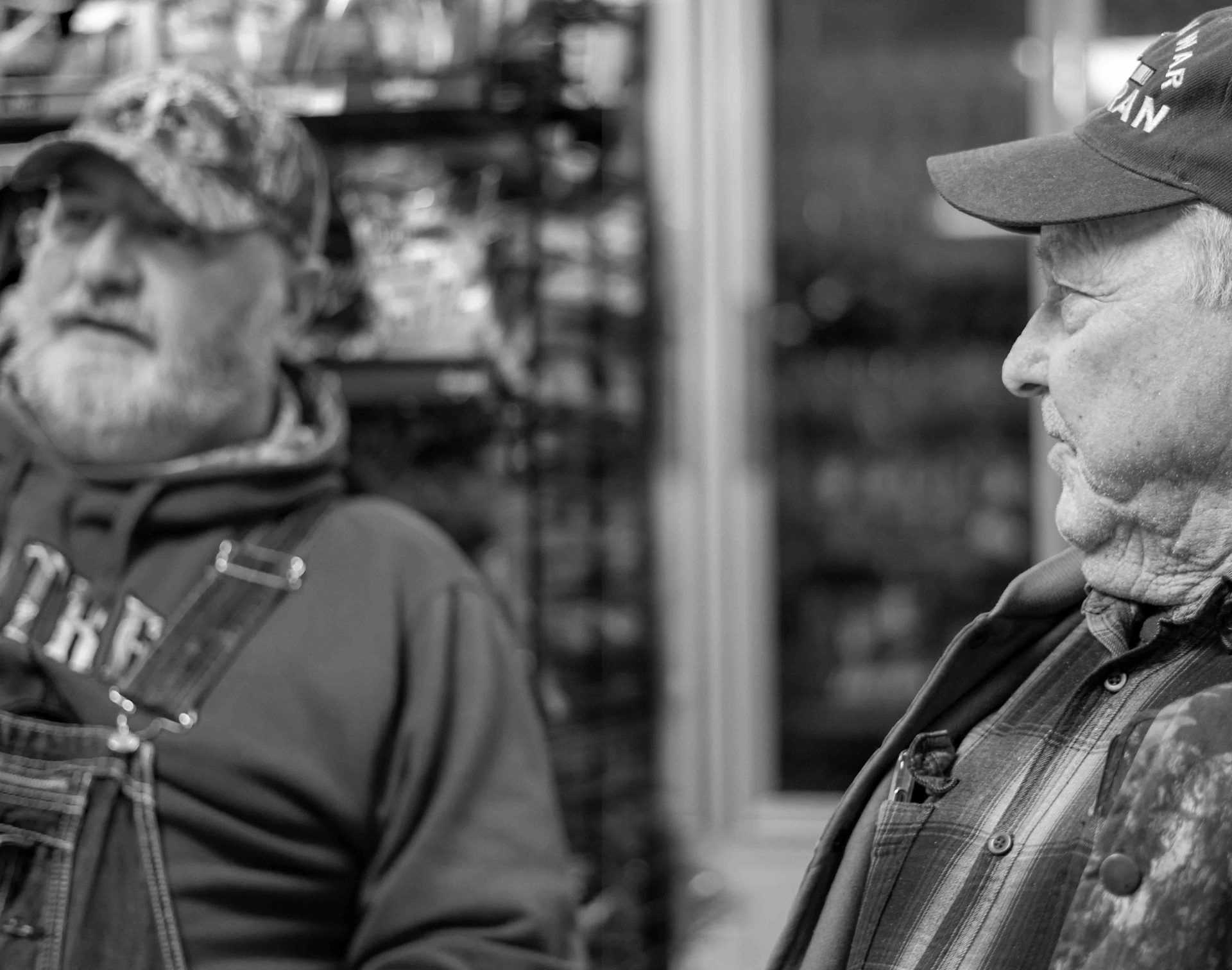 Facial hair, Monochrome photography, Beard, Hat, Headgear, Cap, Jacket, Wrinkle, Moustache