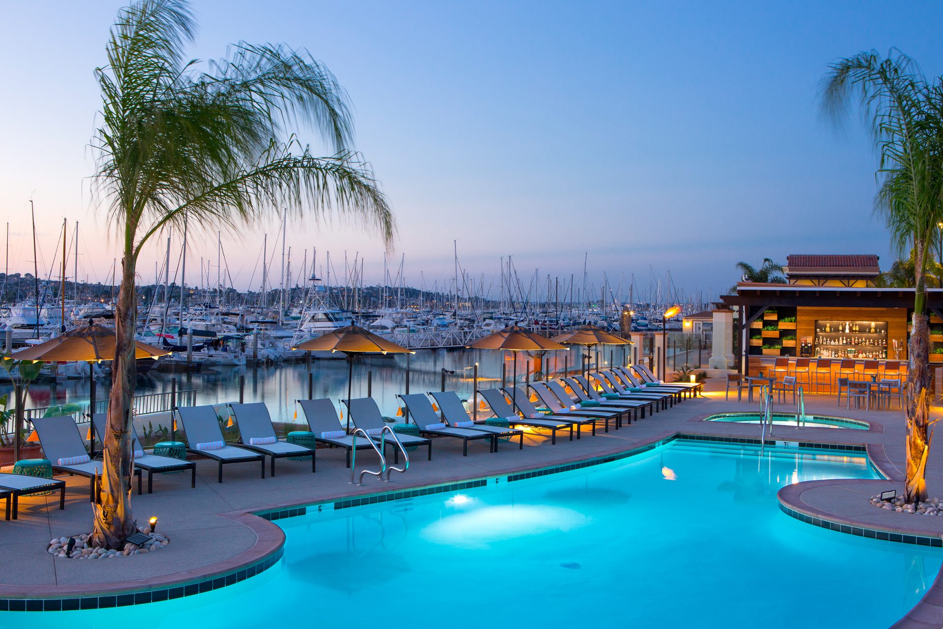 Swimming pool, Seaside resort, Outdoor furniture, Water, Sky, Light, Azure, Building, Arecales, Tree