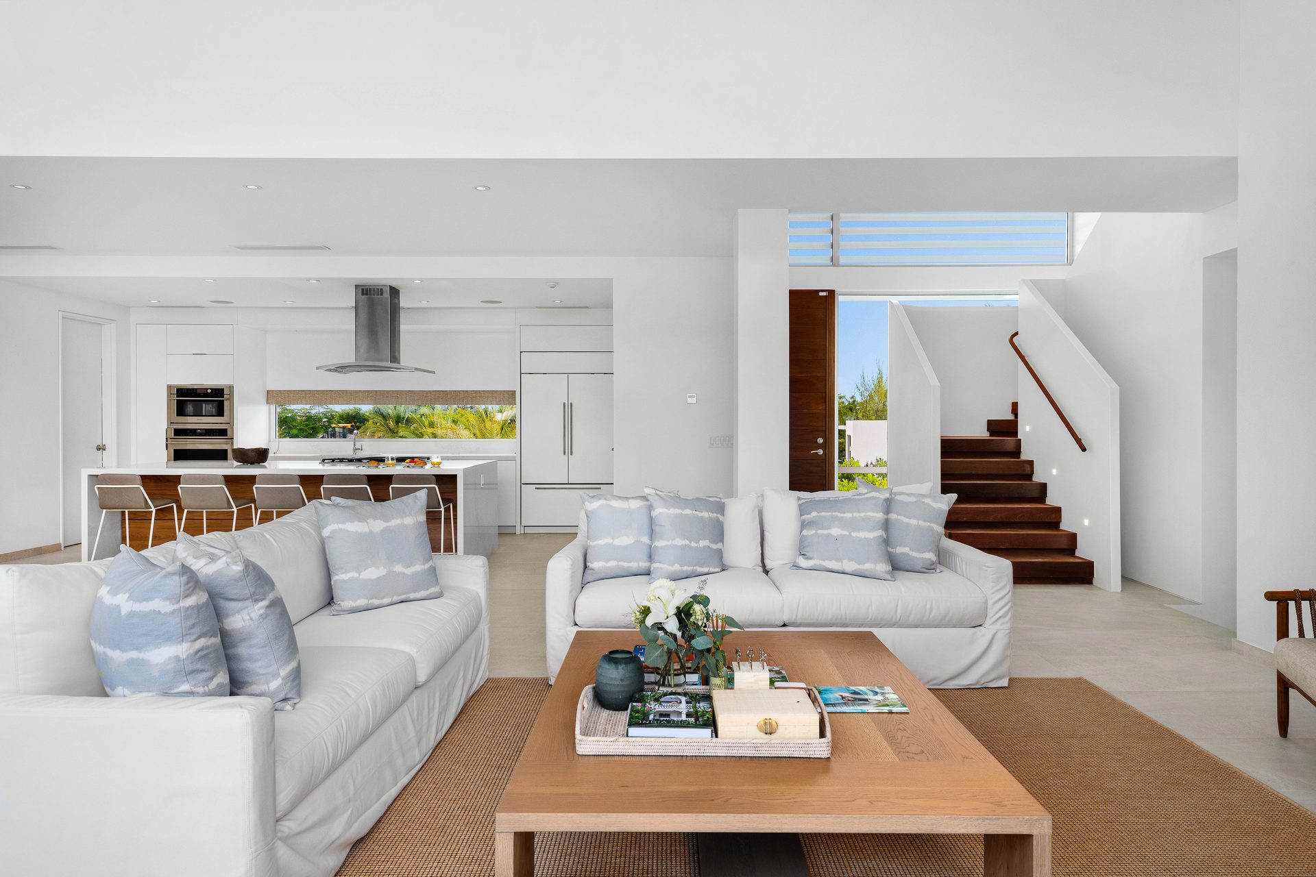 studio couch, Living room, Interior design, Table, Furniture, Shelving, Bookcase, Floor, Comfort
