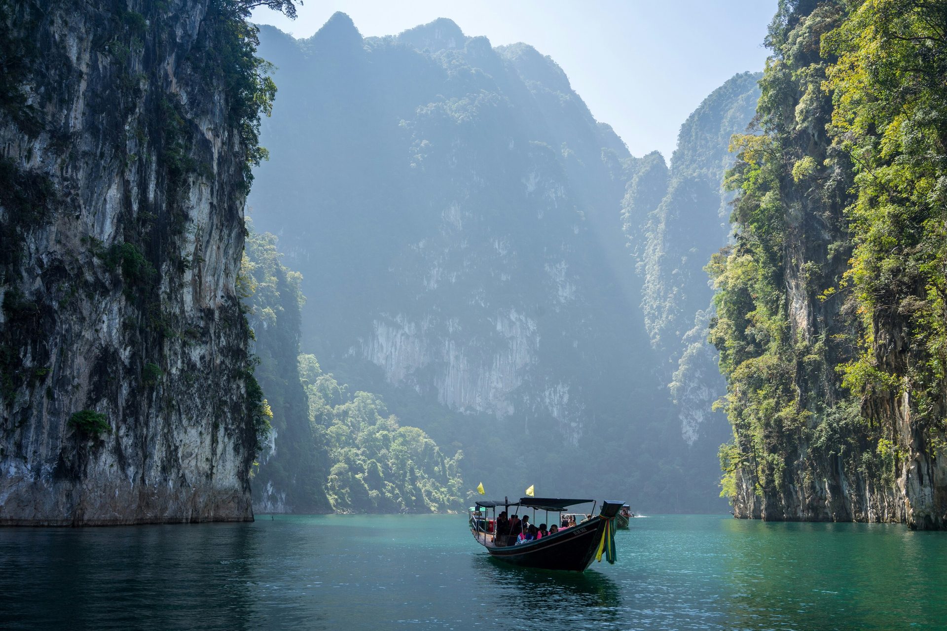Water resources, Natural landscape, Boat, Vehicle, Mountain, Watercraft, Sky, Lake, Tree
