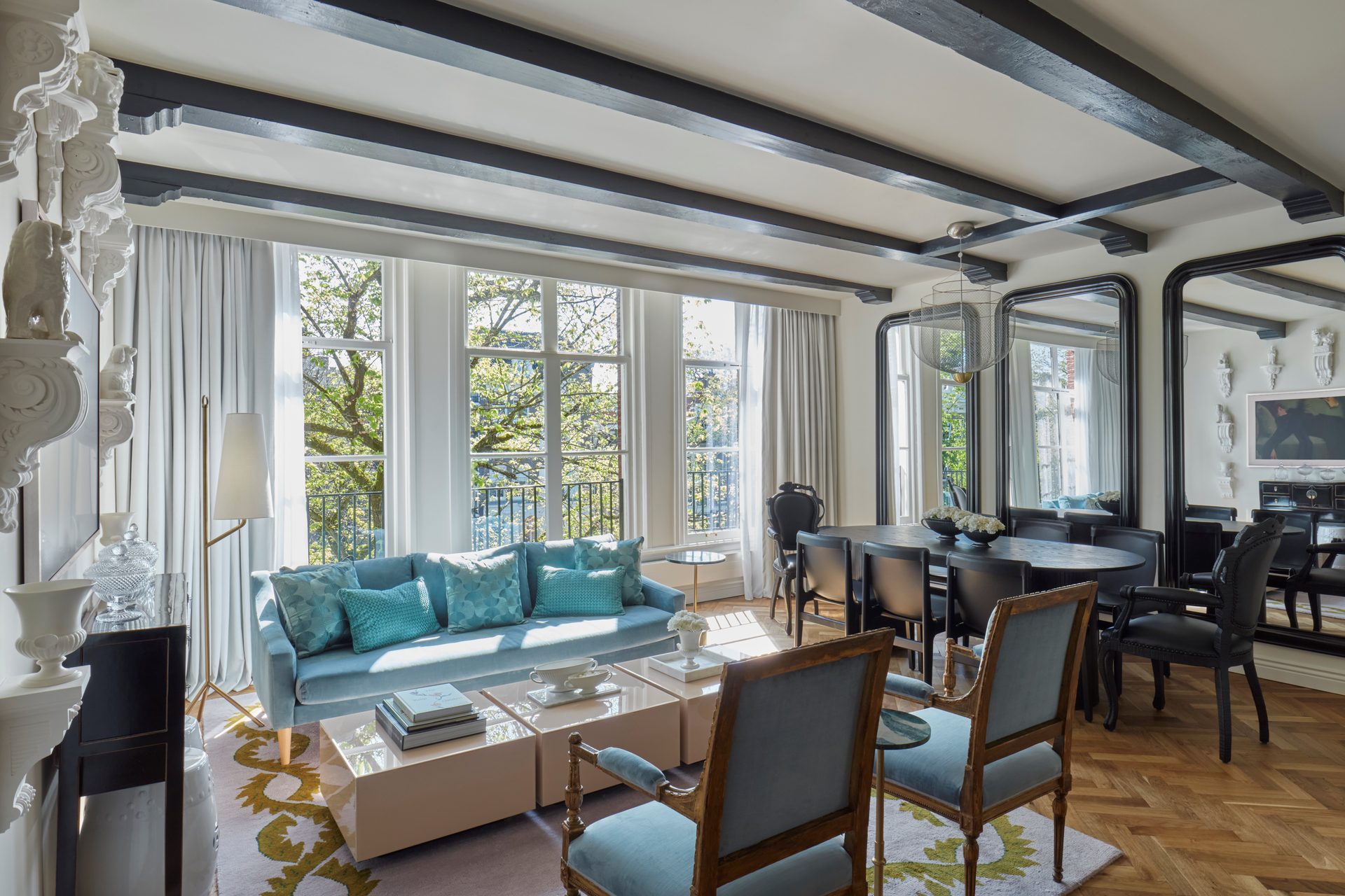 Living room, Furniture, Table, Property, Couch, Window, Azure, Building, Chair, Lighting