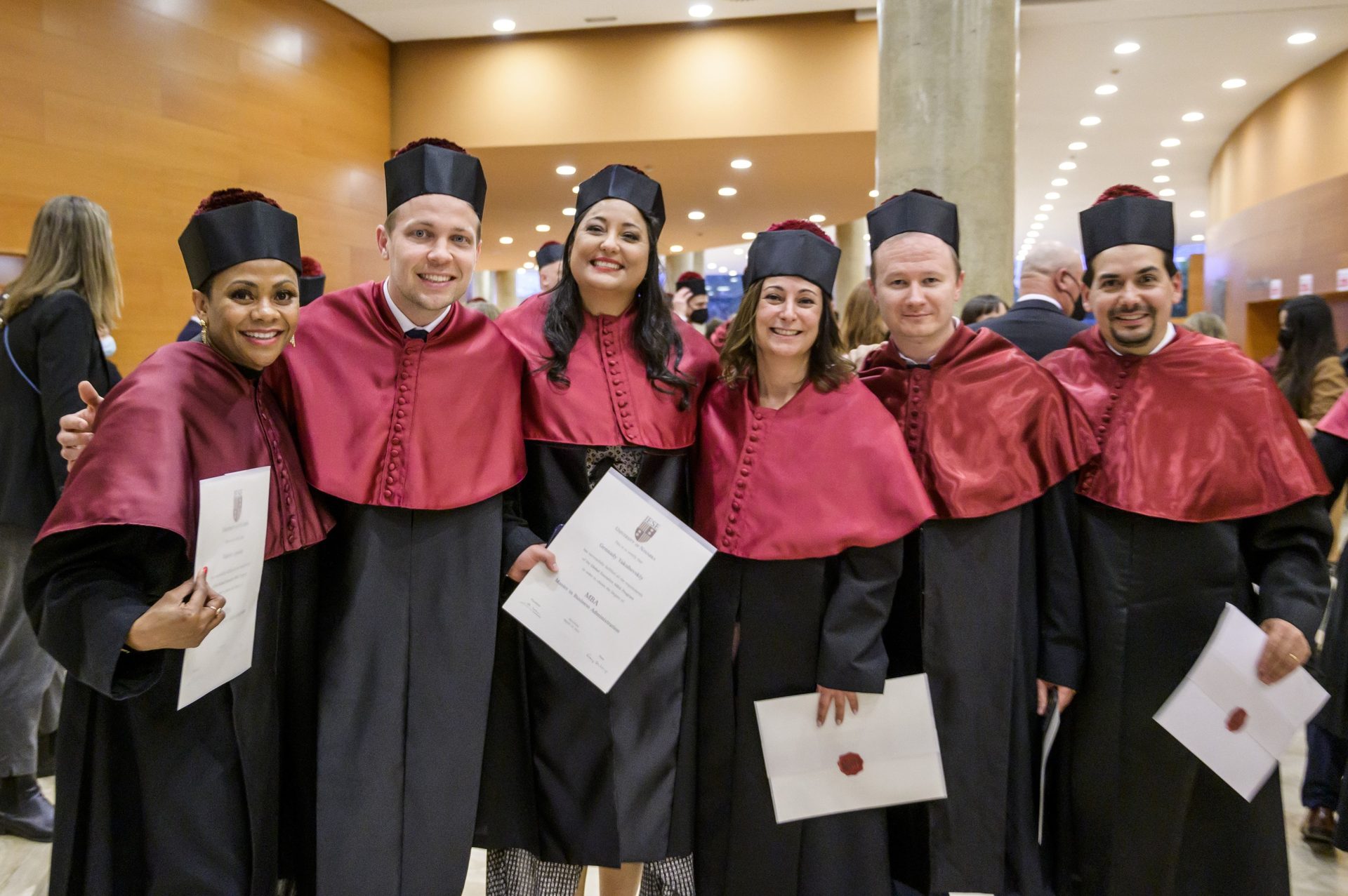Academic dress, Social group, Smile, Scholar, Mortarboard, Graduation, Headgear, Community, Phd