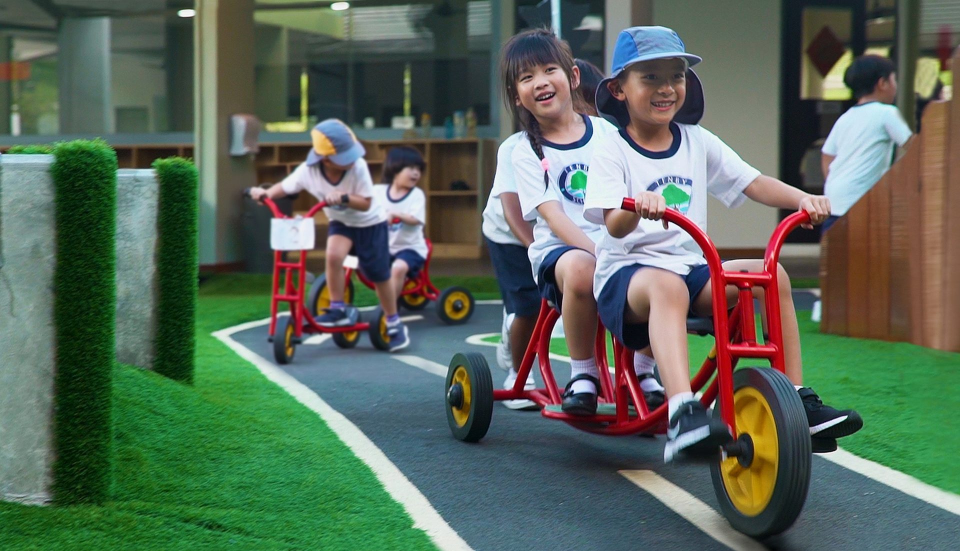 Riding toy, Motor vehicle, Wheel, Tire, Shorts, Smile, Green, Hat, Plant