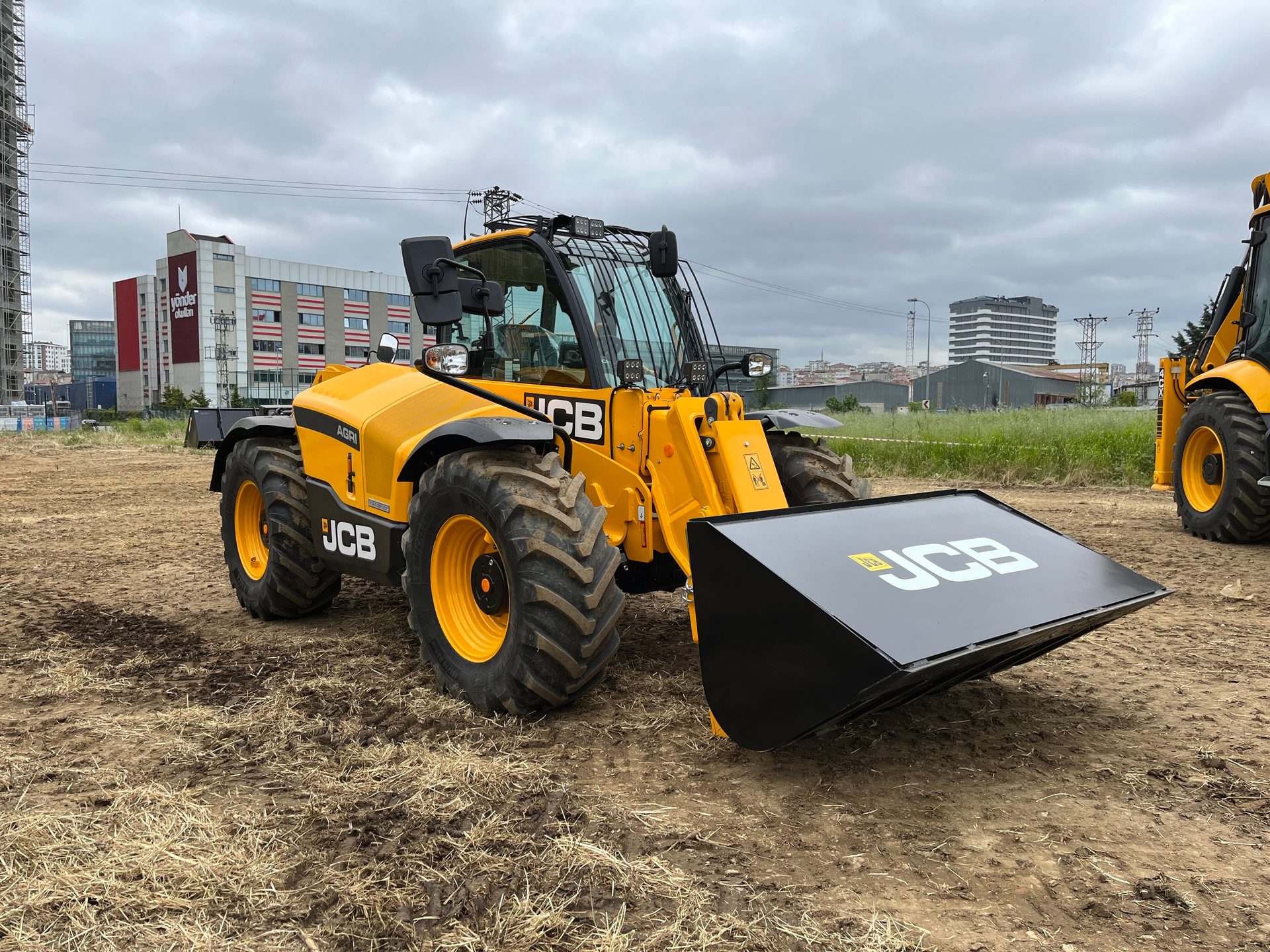 Automotive tire, Motor vehicle, Wheel, Sky, Cloud, Tread, Rolling, Bulldozer