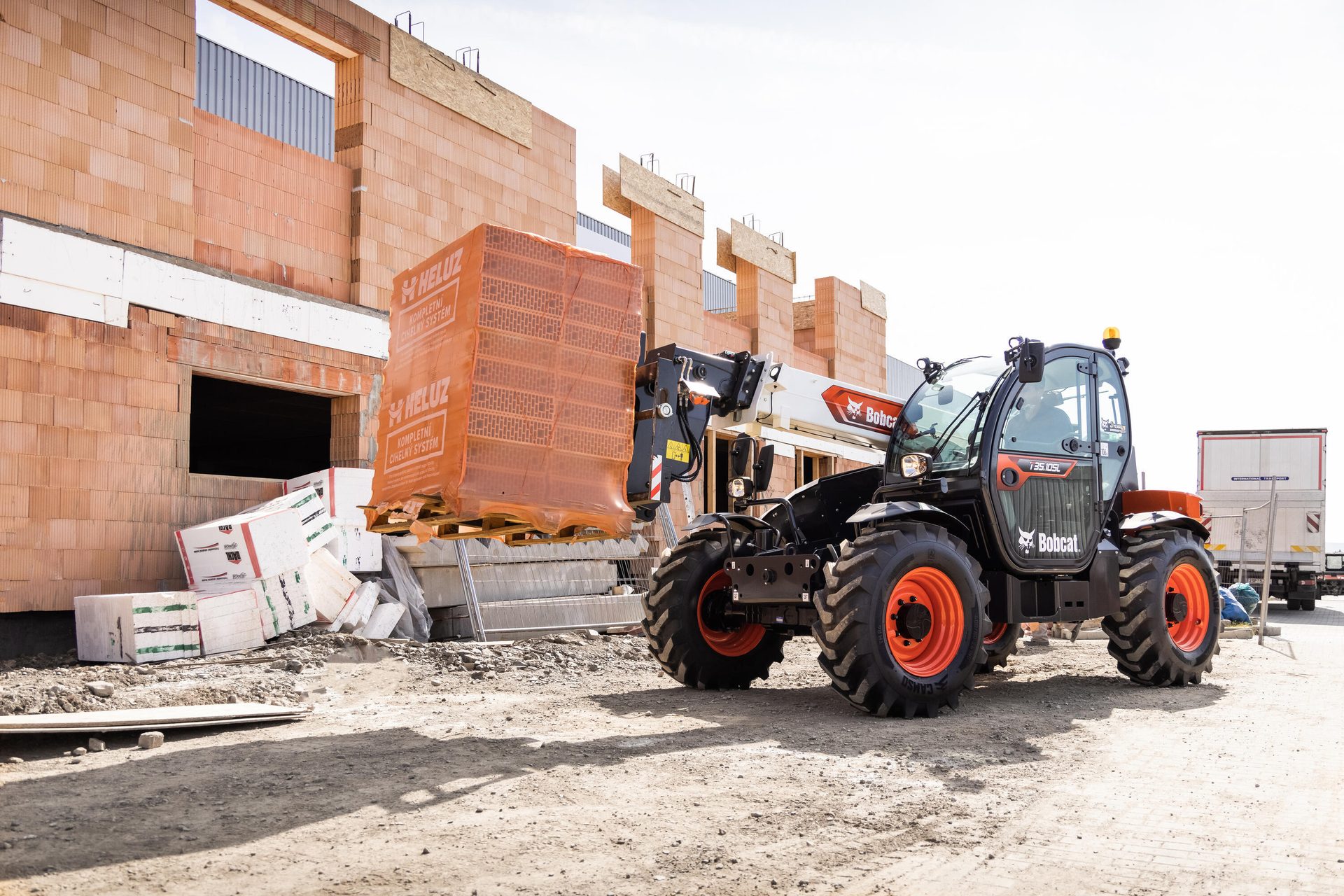 Automotive tire, Motor vehicle, Road surface, Wheel, Tractor, Tread, Building, Asphalt