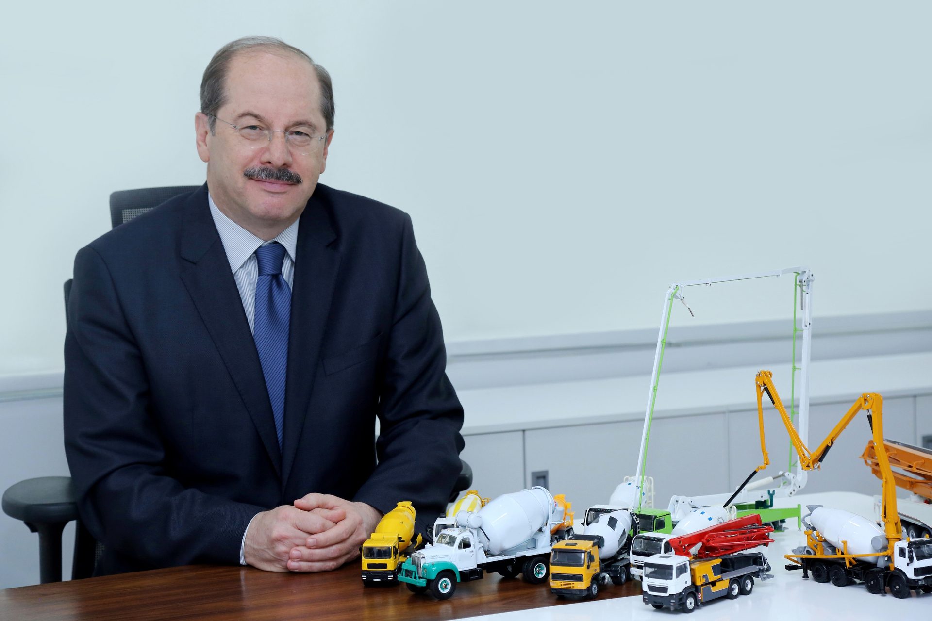 Dress shirt, Smile, Table, Tie, Toy