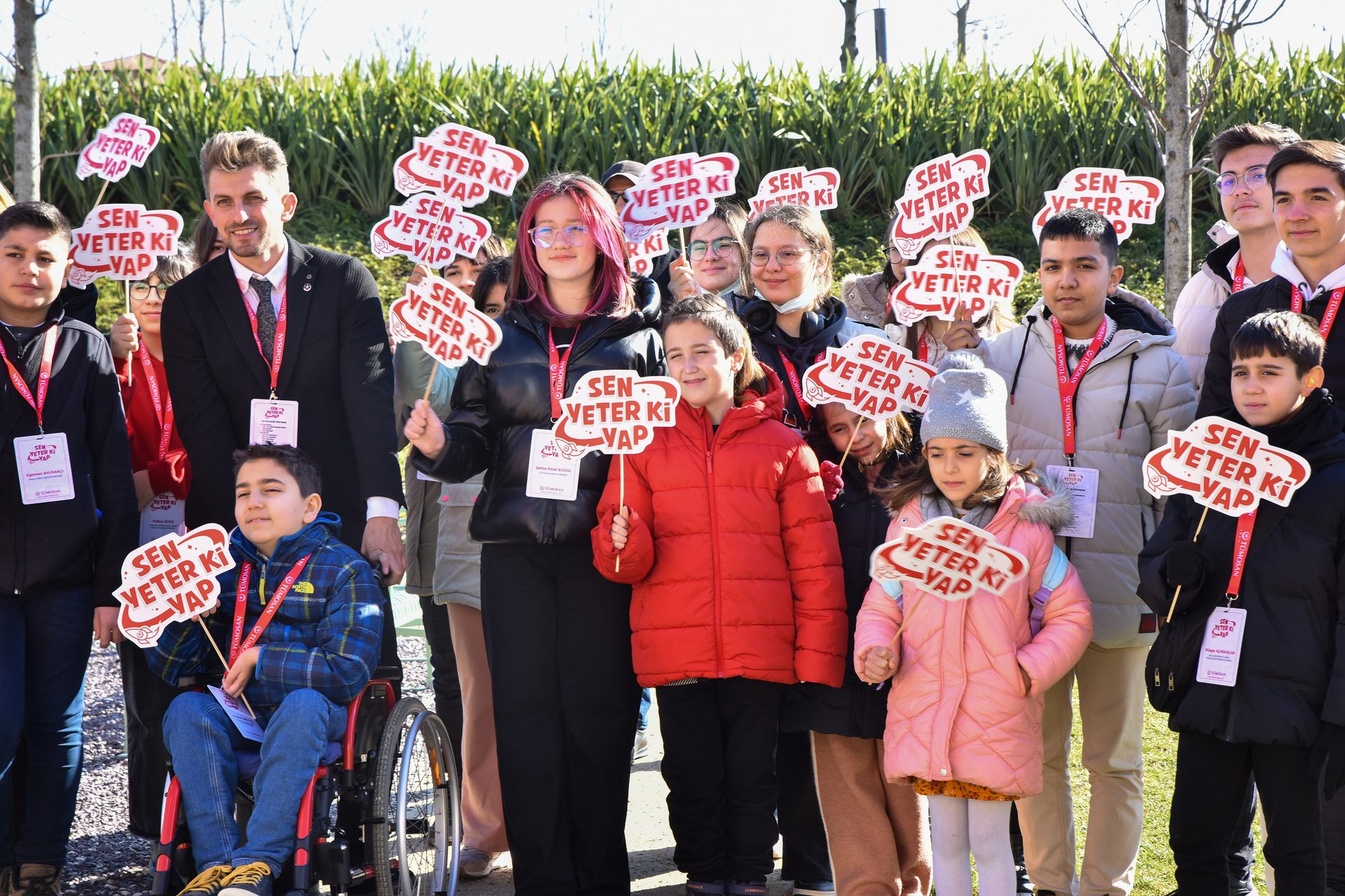 Social group, Smile, Wheelchair, Wheel, Hat, Tire, Chair, Community