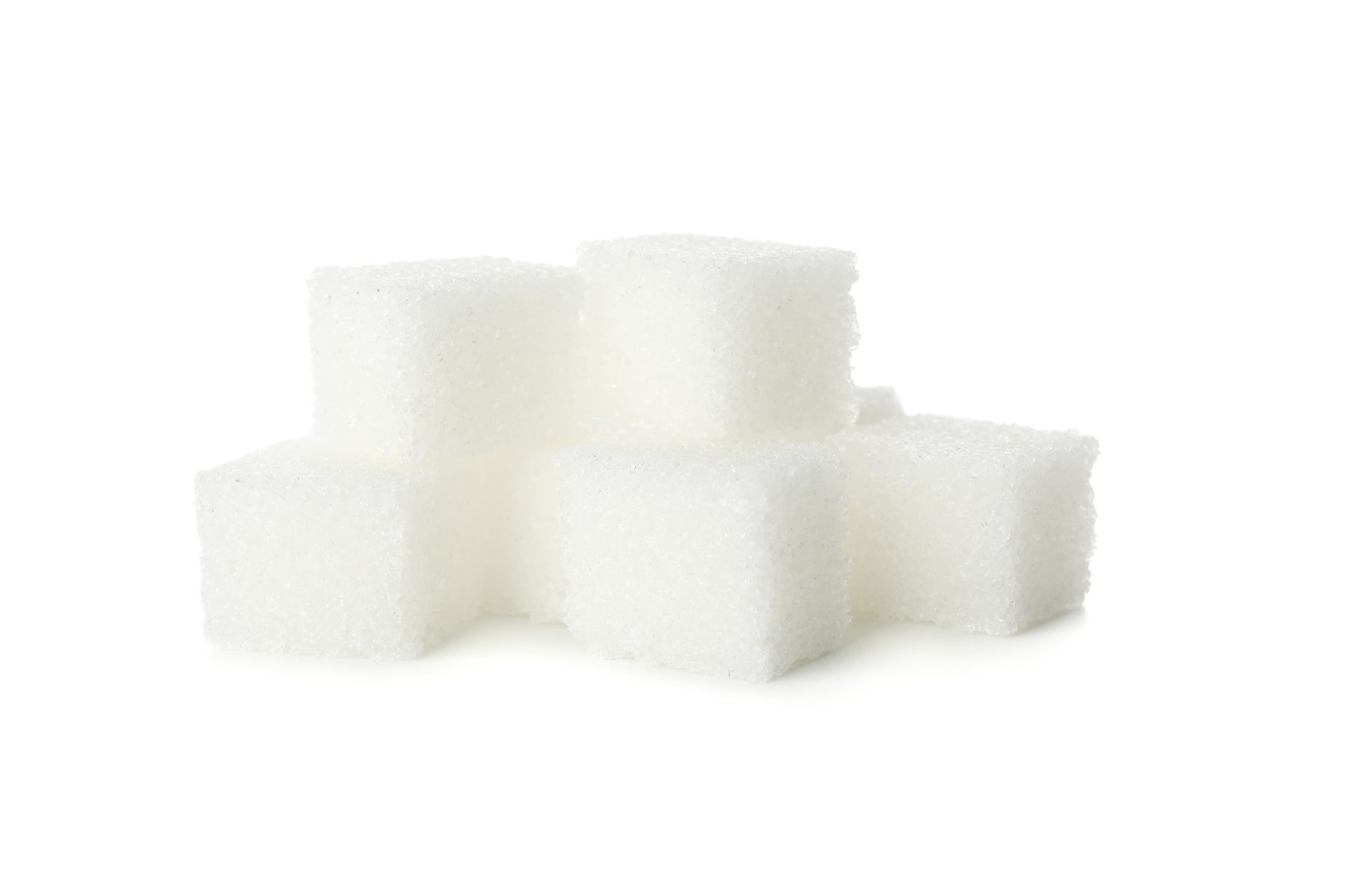 stack of white sugar cubes on white background