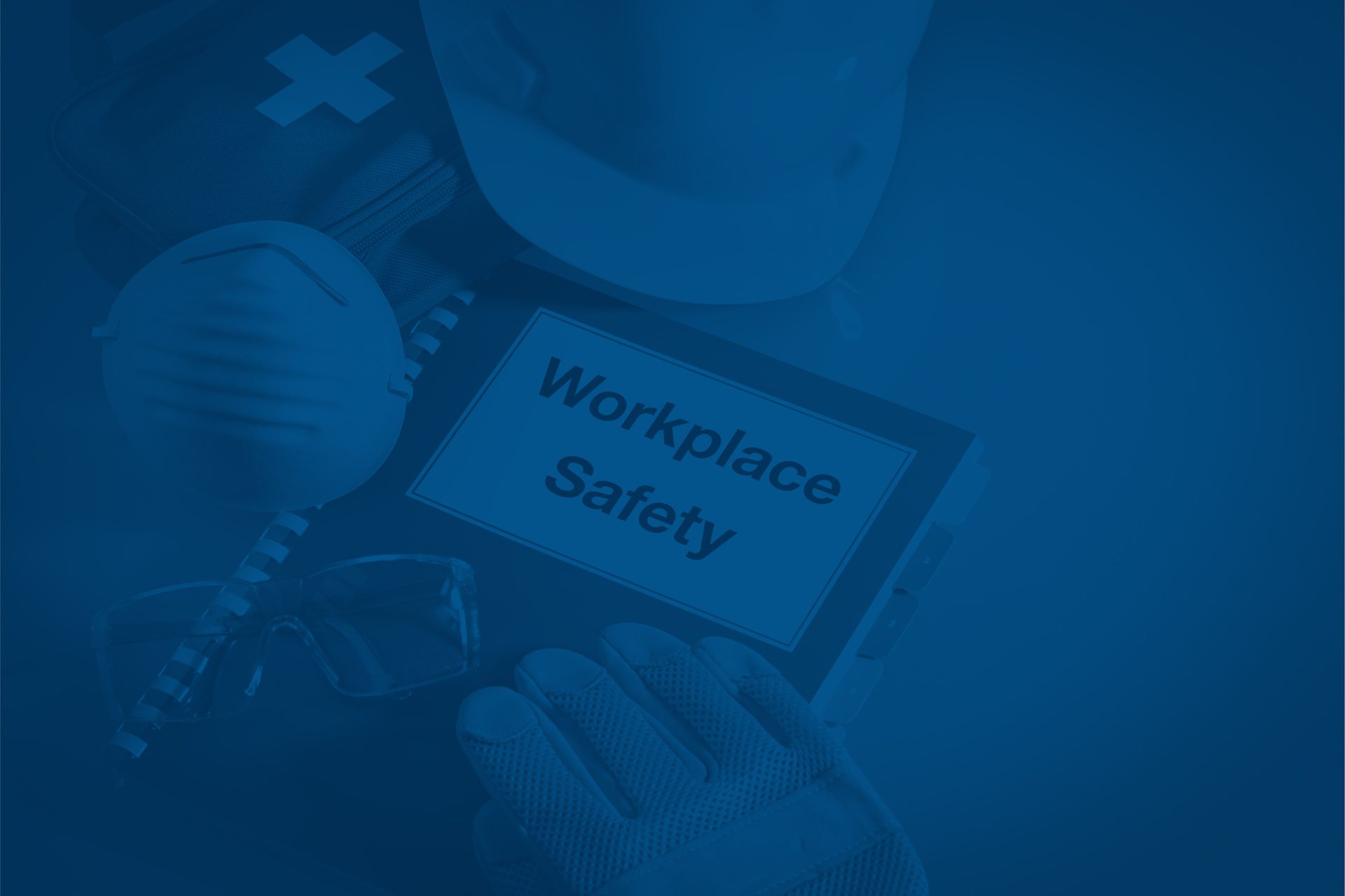 Workplace safety essentials: hard hat, mask, glasses, gloves, first aid, and "Workplace Safety" sign.