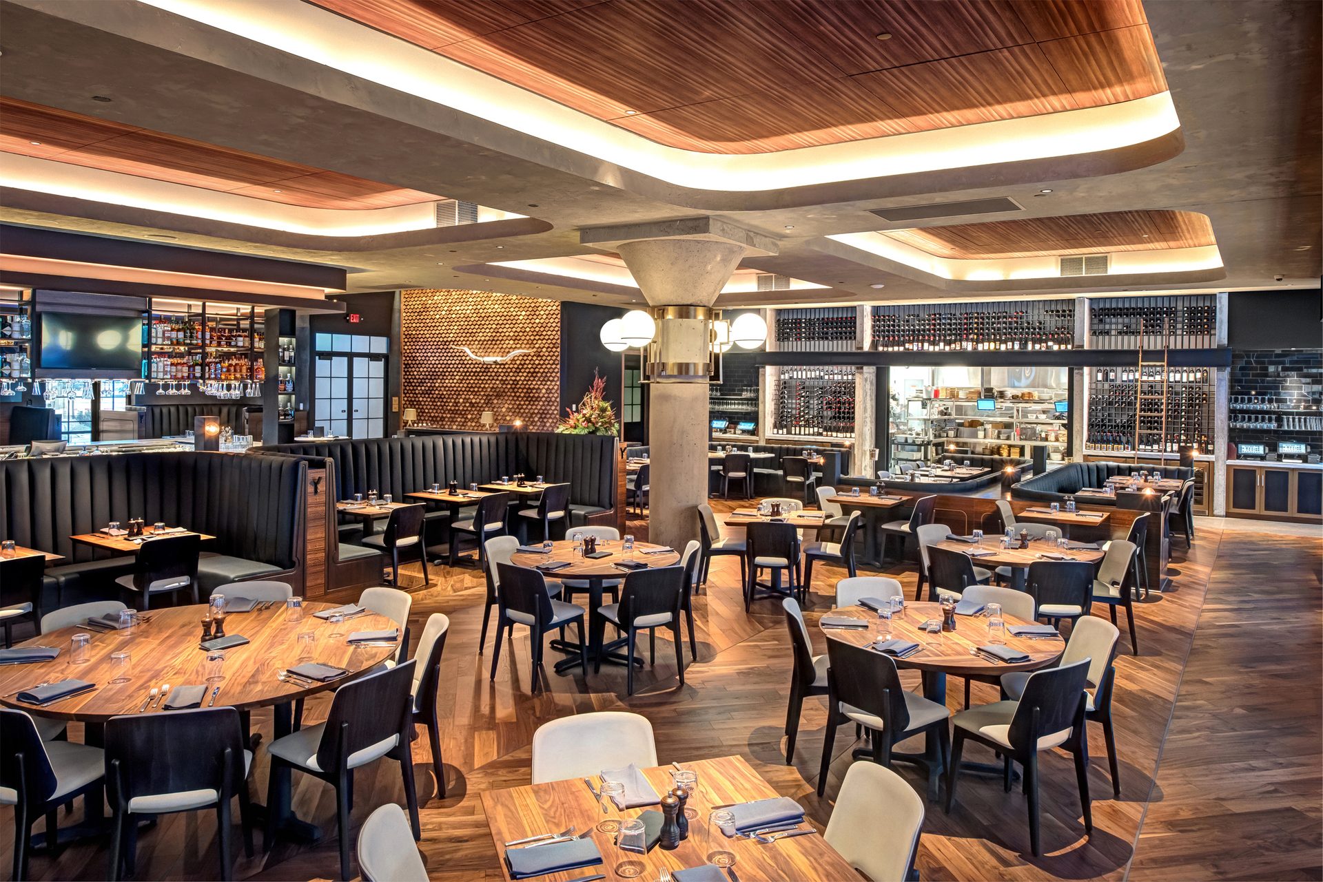 Interior design of modern restaurant with a modern wood finish ceiling system.