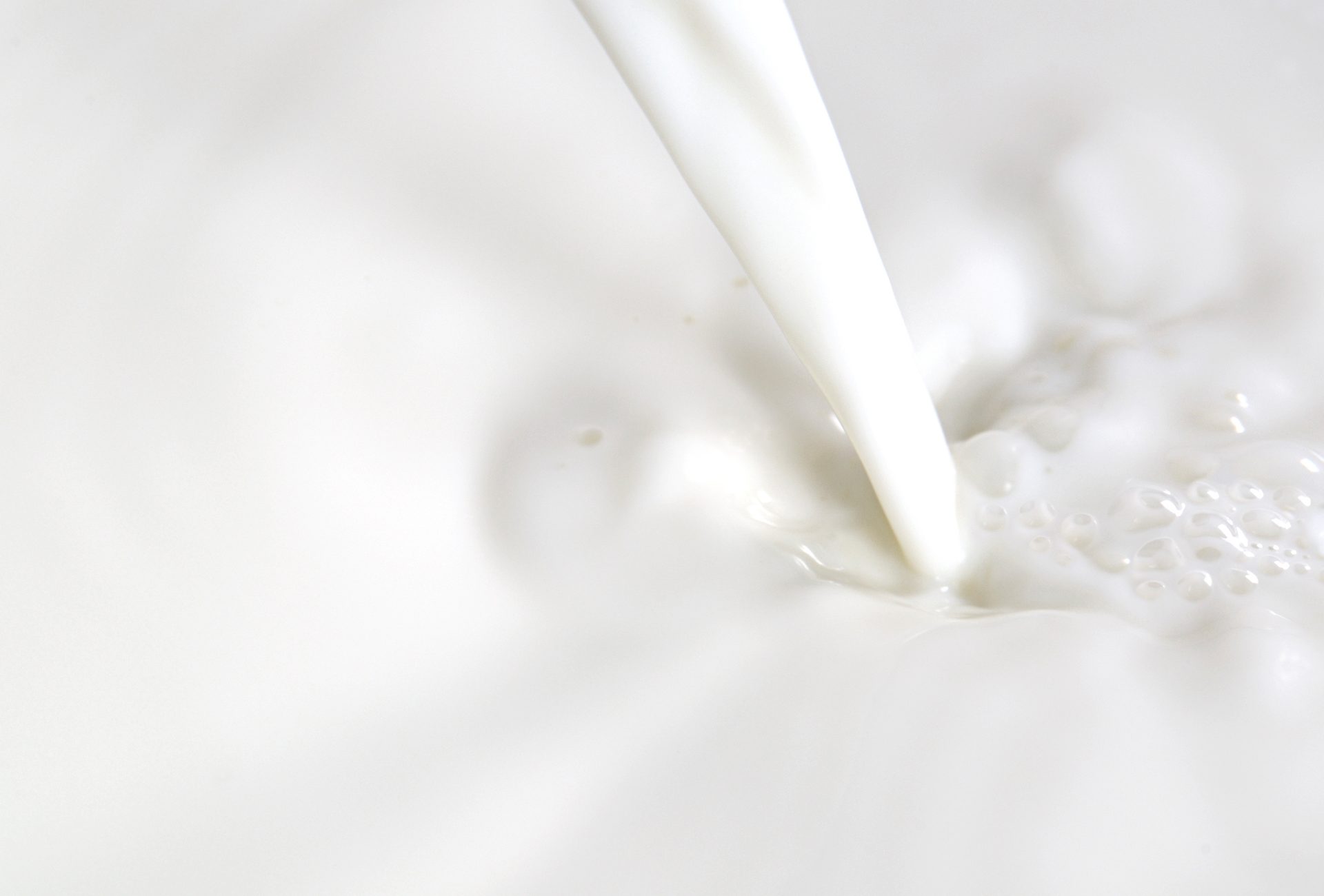 closeup of pouring milk
