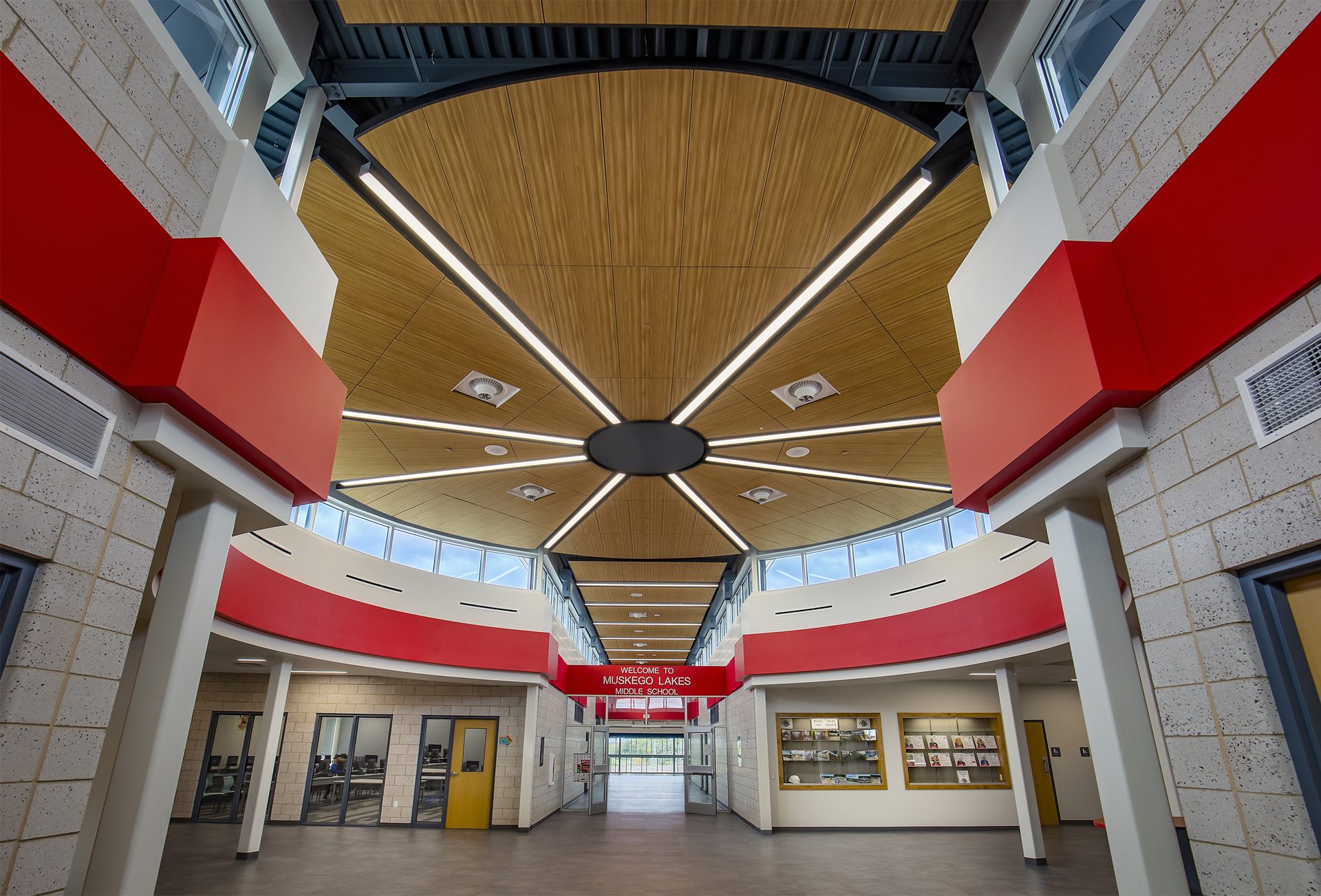 Middle School entrance with circular layout and wood finish ceiling.