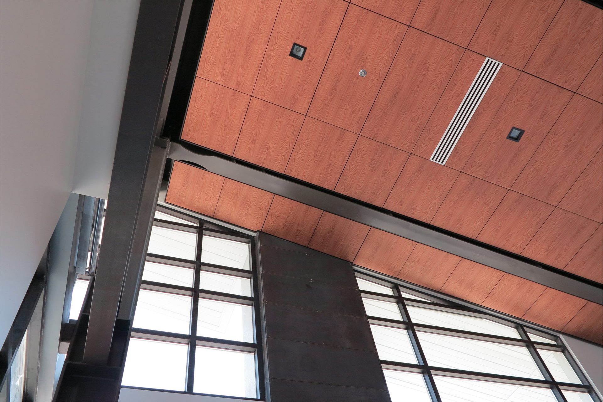 View looking upward at a wood finish ceiling system.