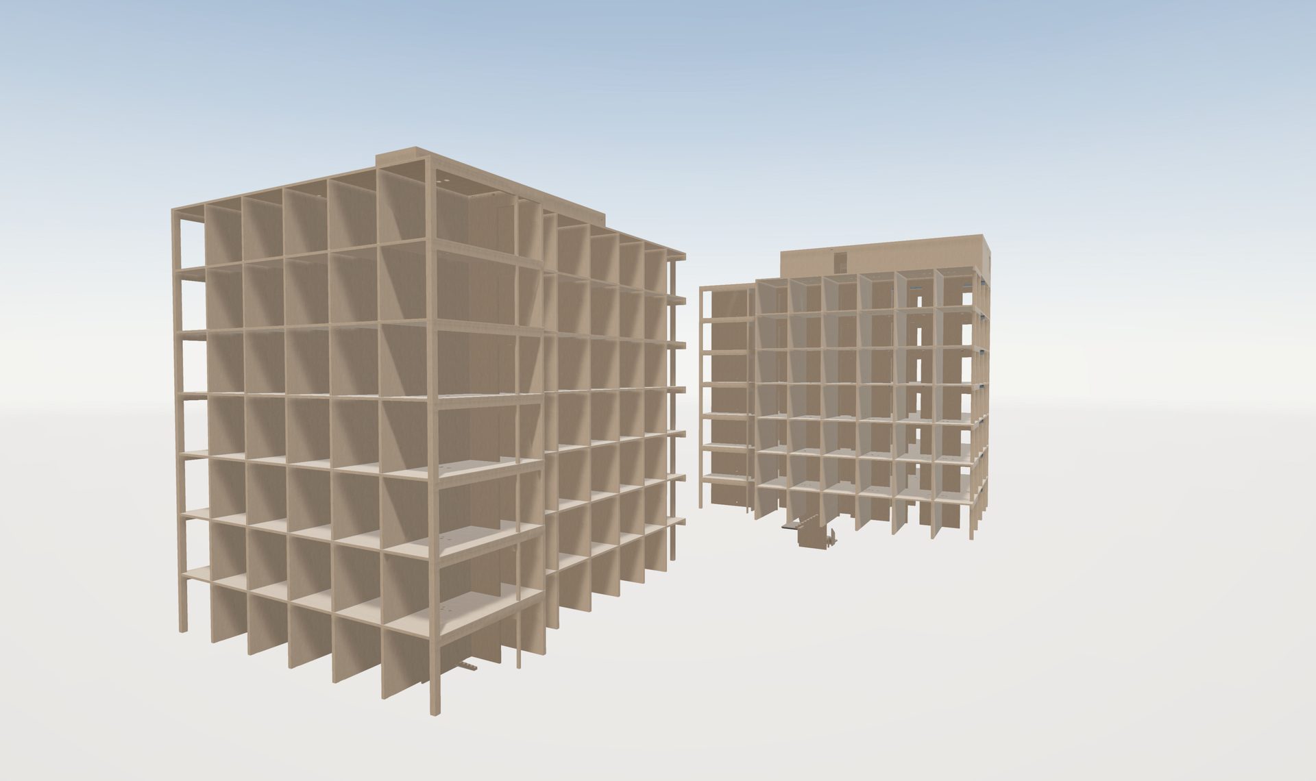Two multi-story skeletal building frameworks.