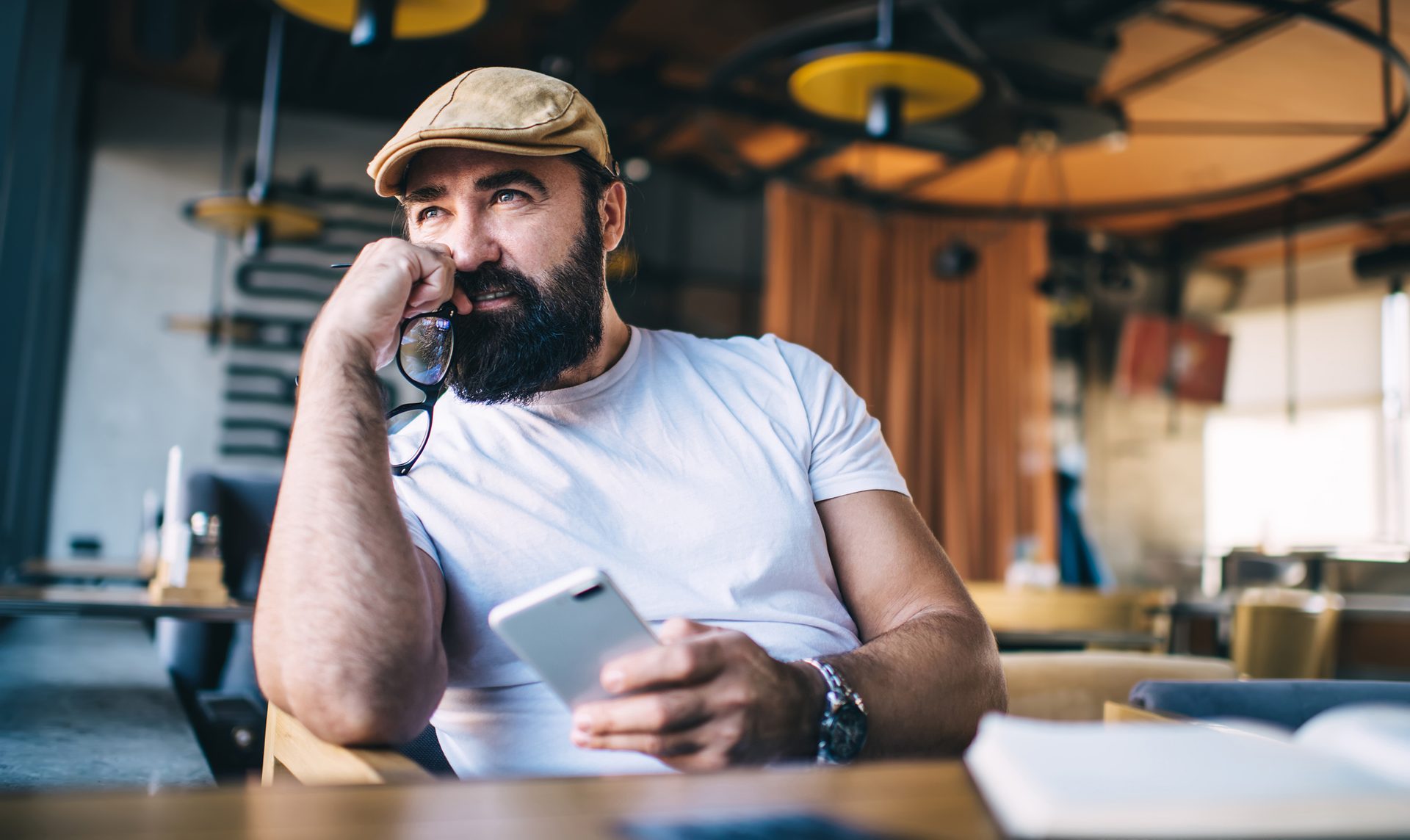 Facial hair, Electronic device, Beard, Gadget, Moustache, Wrist, Cap
