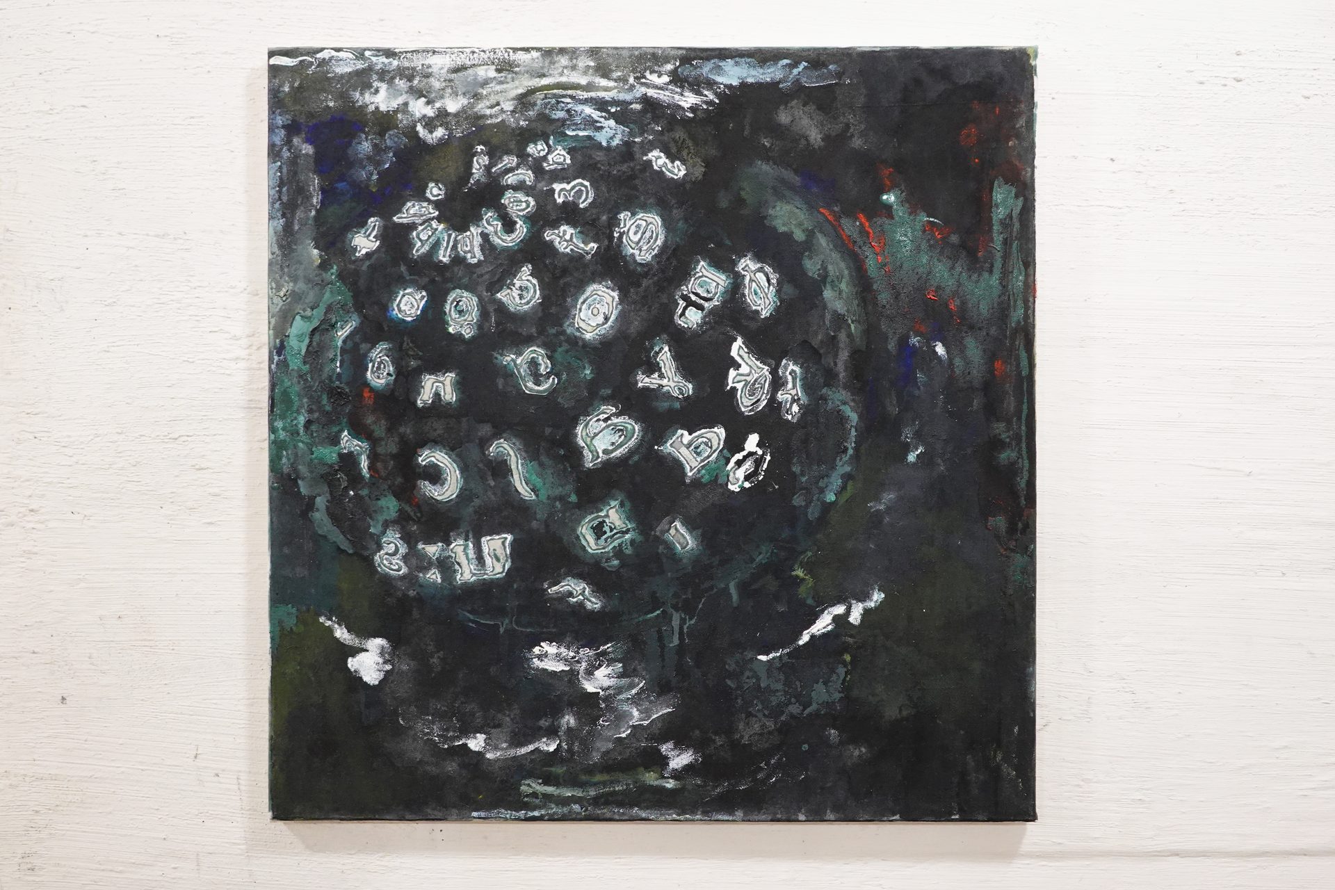 Abstract painting with white, green-tinged symbols on a dark, textured background, creating a mystical aura.