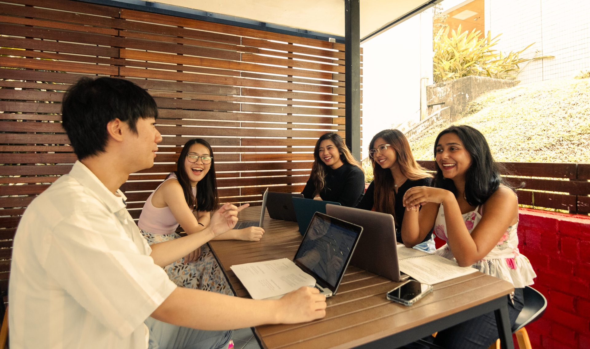 Personal computer, Interior design, Smile, Table, Desk, Interaction, Chair, Comfort