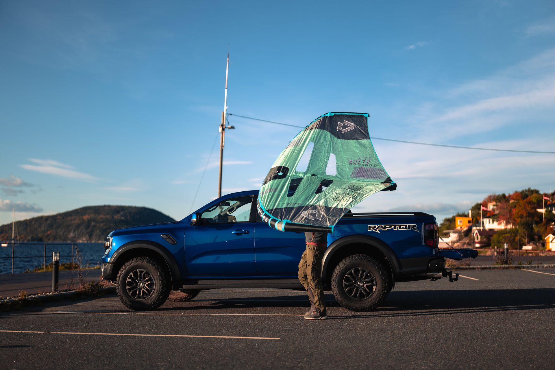 Land vehicle, Automotive tire, Wheel, Sky, Cloud, Car, Hood, Blue