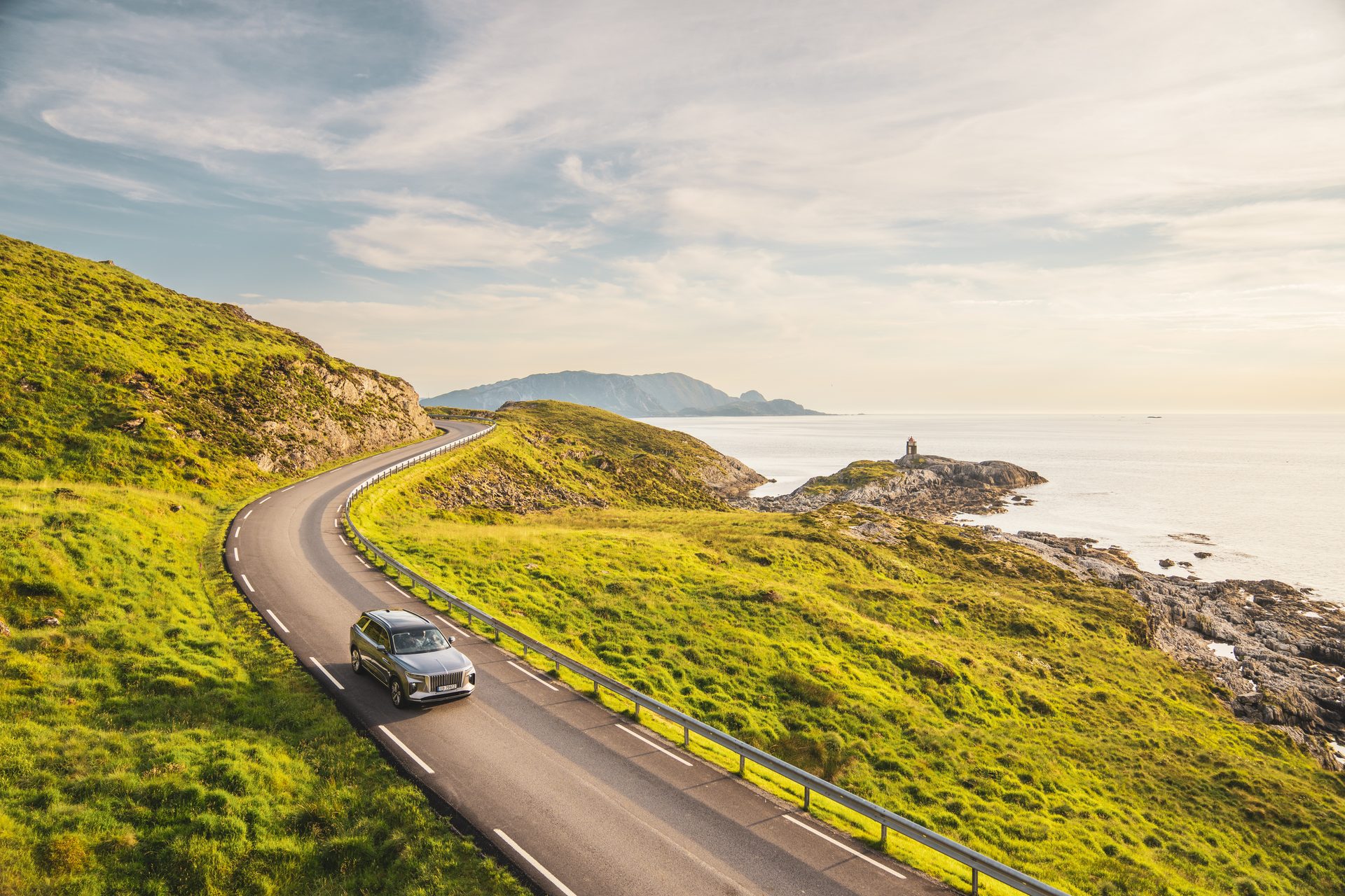 Road surface, Natural landscape, Cloud, Sky, Car, Water, Vehicle, Asphalt, Mountain, Plant