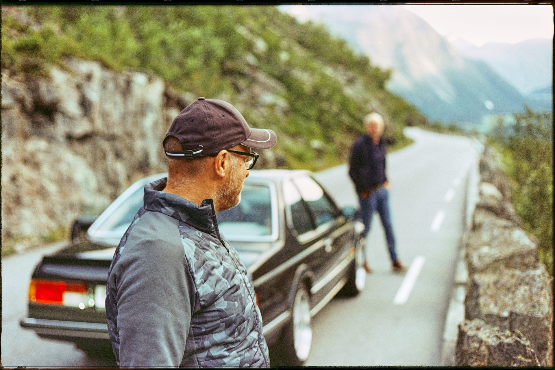 Motor vehicle, Automotive design, Car, Sky, Human, Travel, Gesture, Asphalt