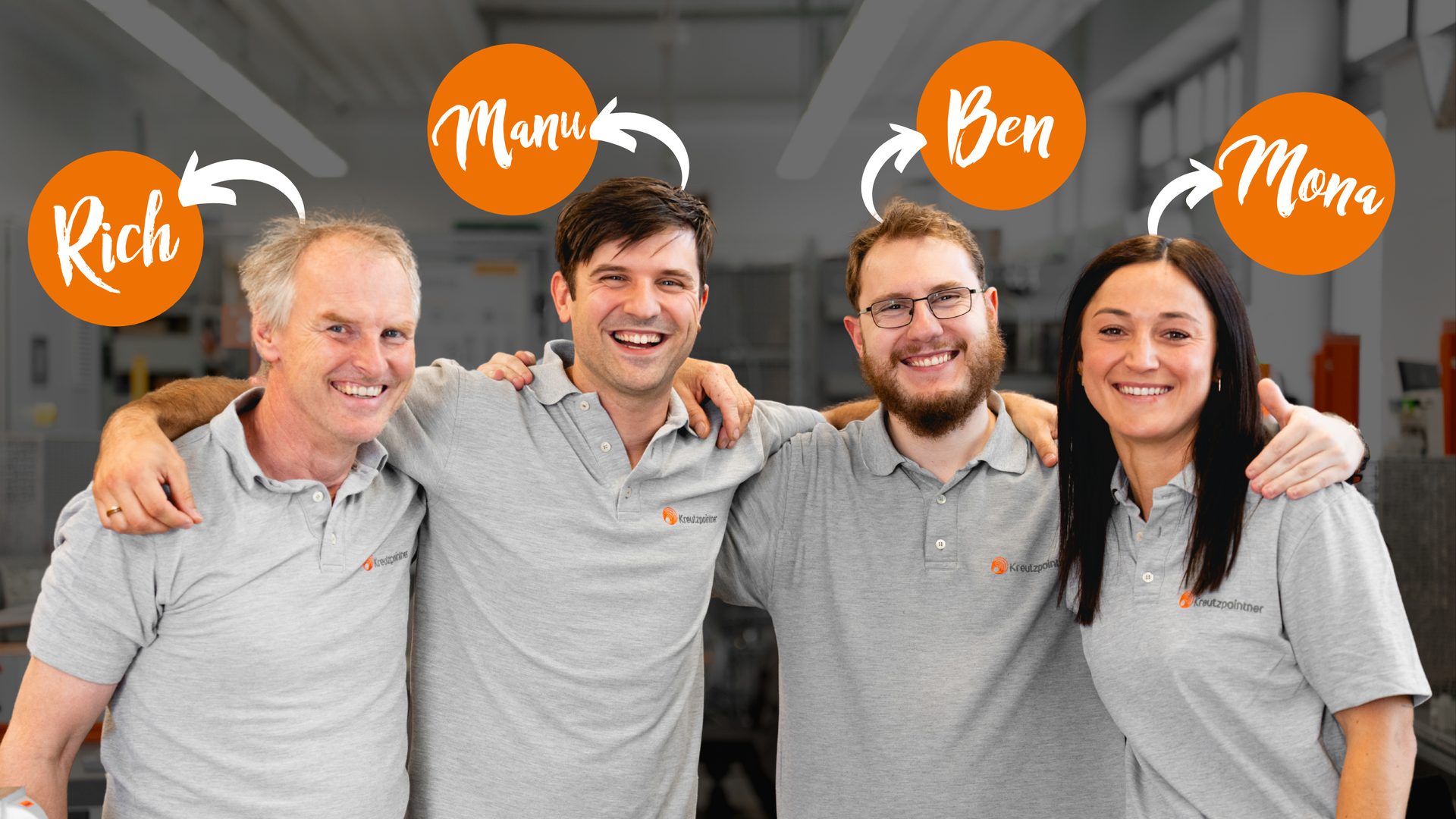 Smiling team: Rich, Manu, Ben, Mona, in matching grey shirts.