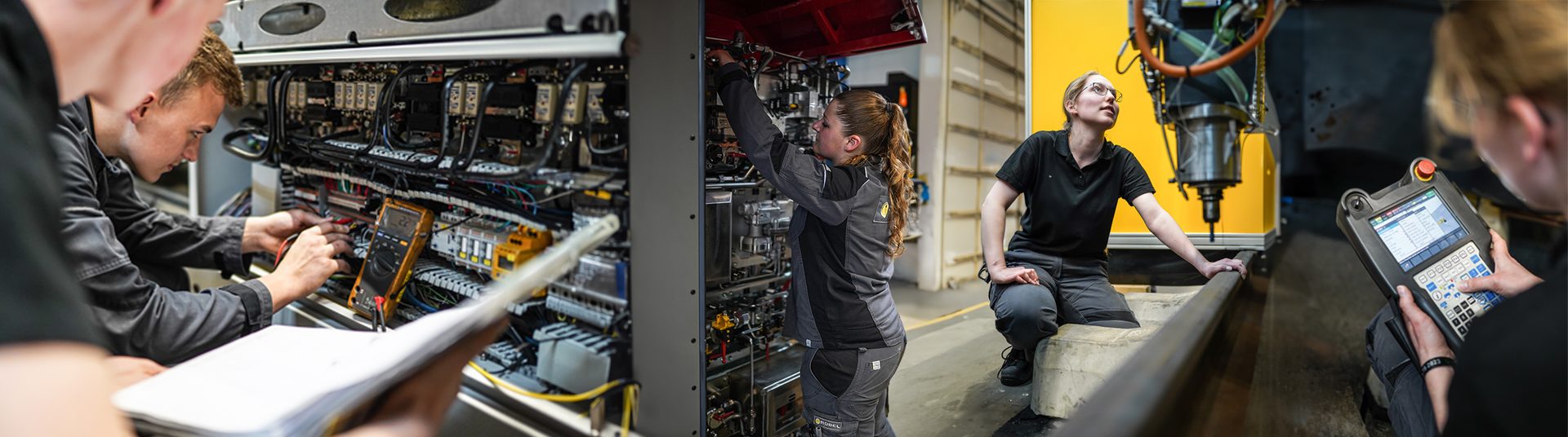 People working on electrical and mechanical systems and operating machinery in an industrial setting.