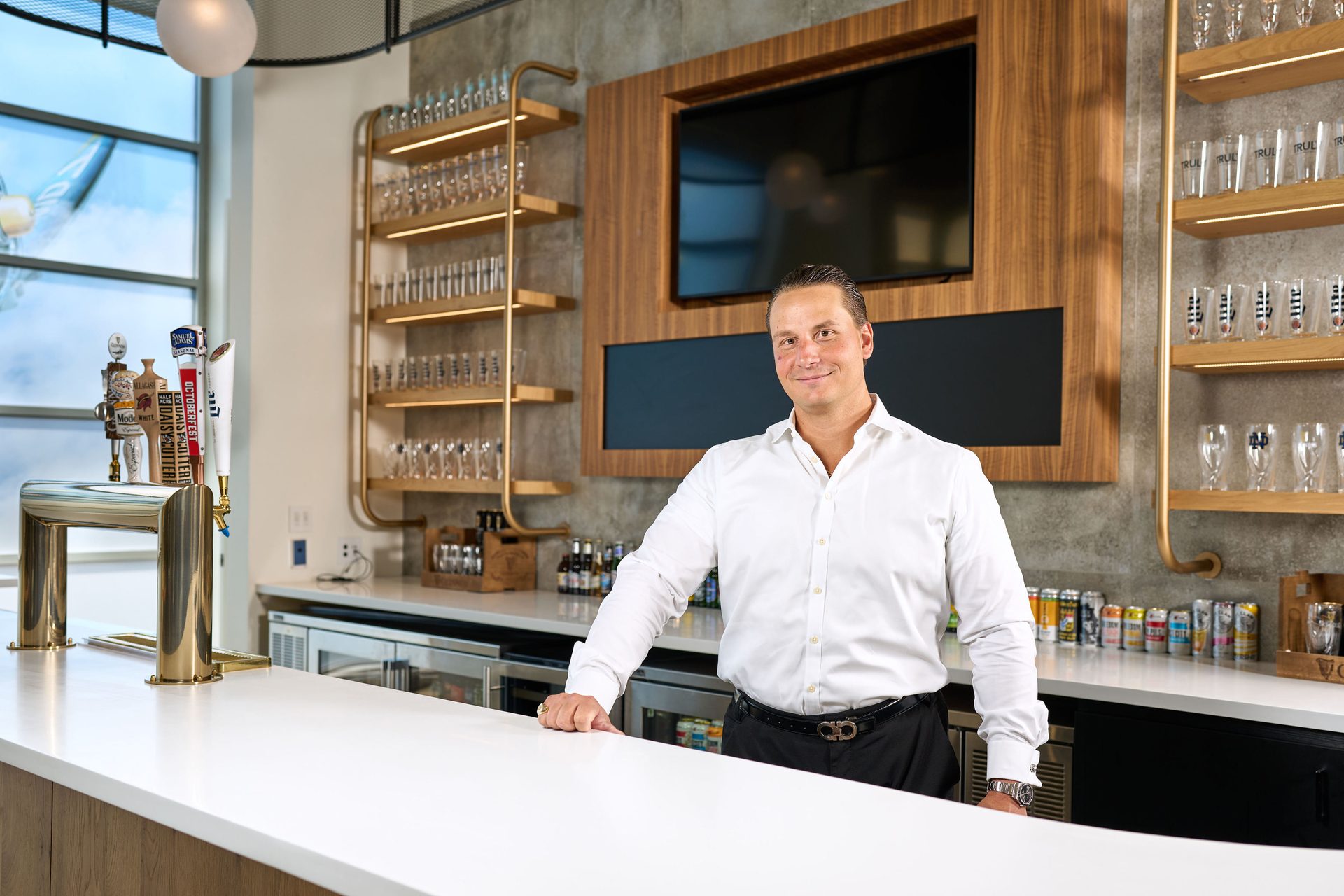 Dress shirt, Cabinetry, Product, Sleeve, Table, Countertop, Shelf, Smile, Eyewear, Kitchen
