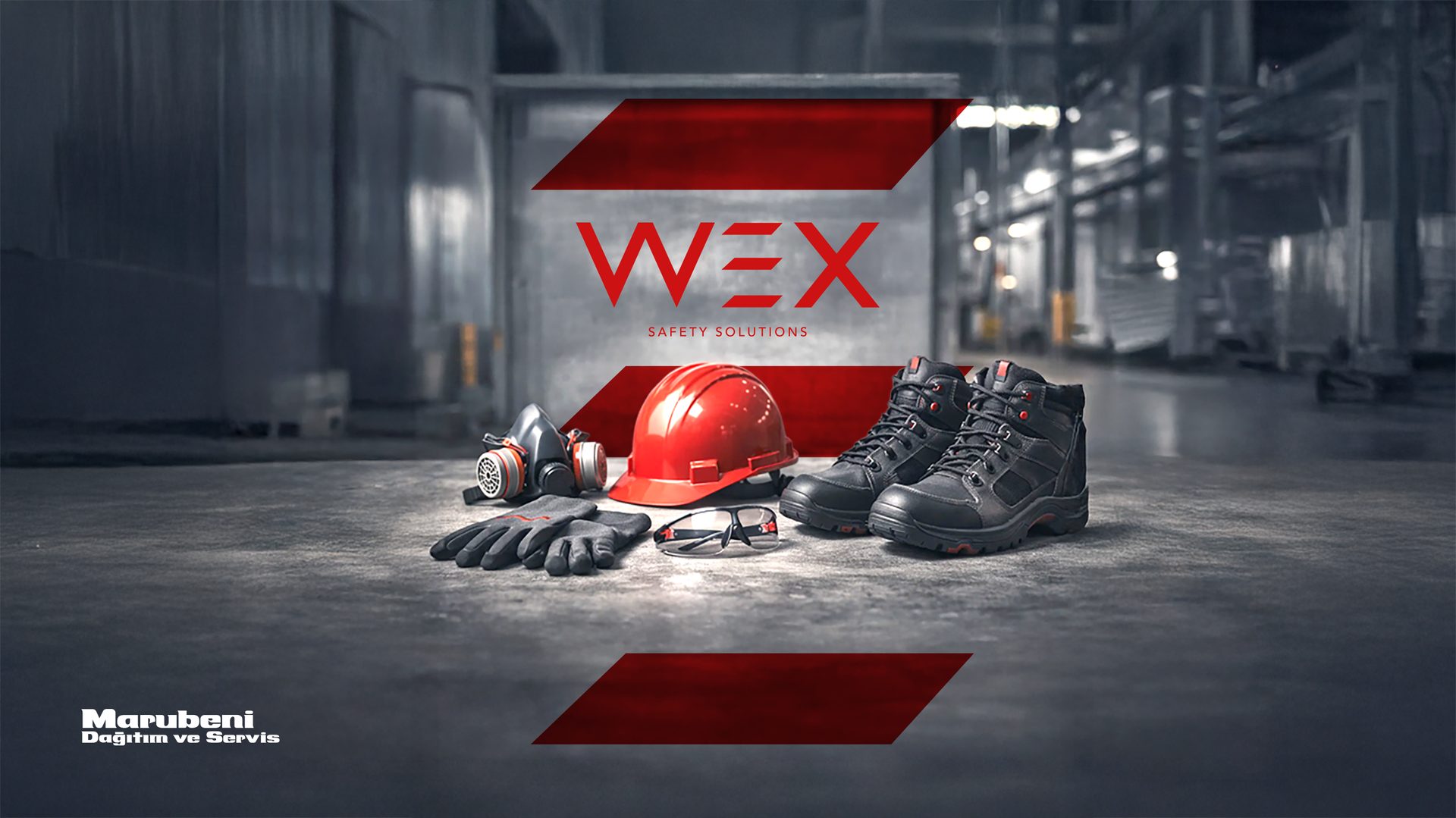 An array of WEX safety gear including a hard hat, respirator, gloves, glasses, and boots on a concrete floor.