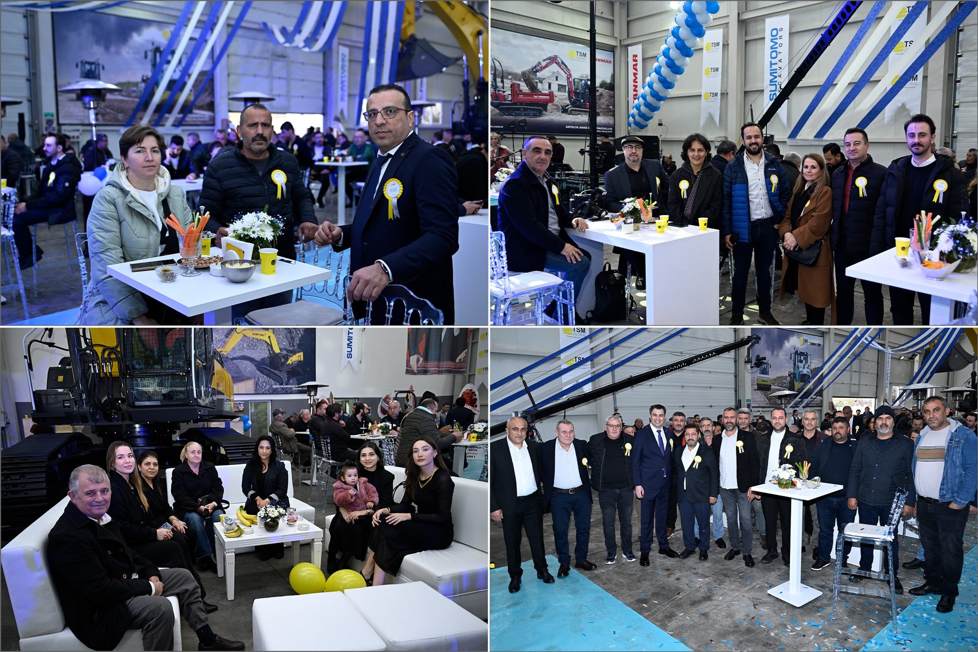 An indoor event with multiple groups of people socializing and posing, surrounded by construction machinery and festive decorations.
