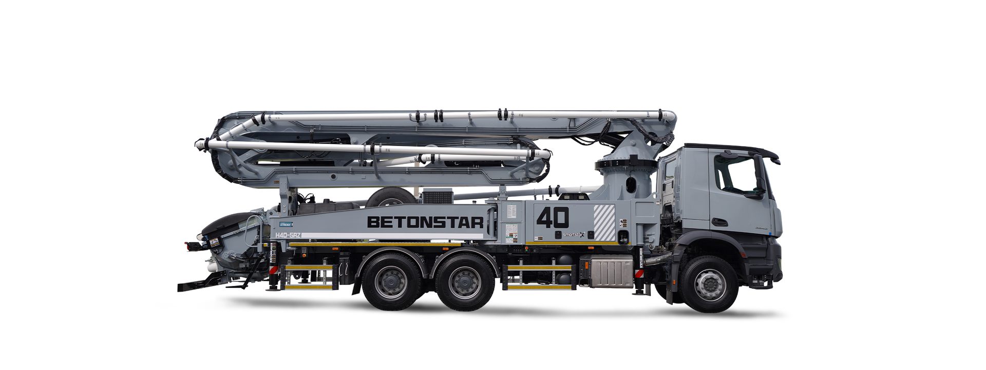 A gray concrete pump truck with a folded boom for construction projects, side view on white background.
