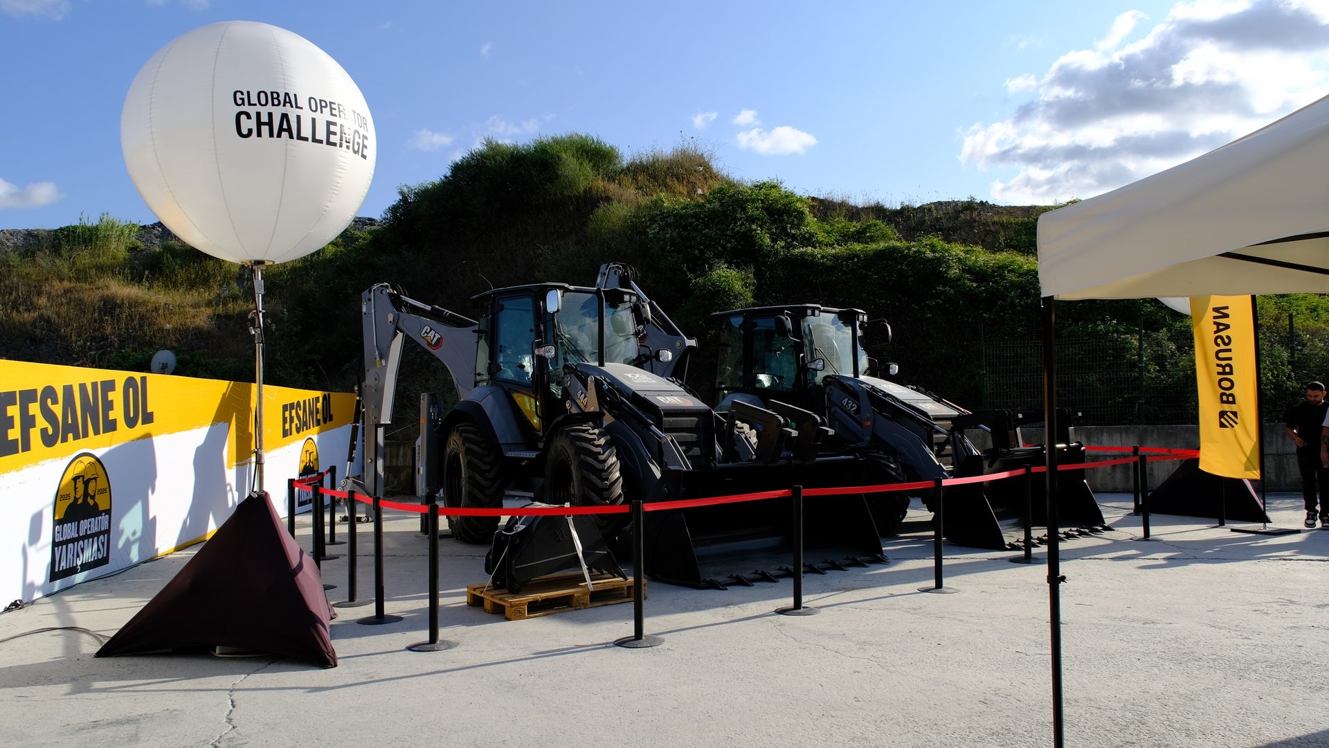 Caterpillar heavy equipment on display at a "Global Operator Challenge" event.