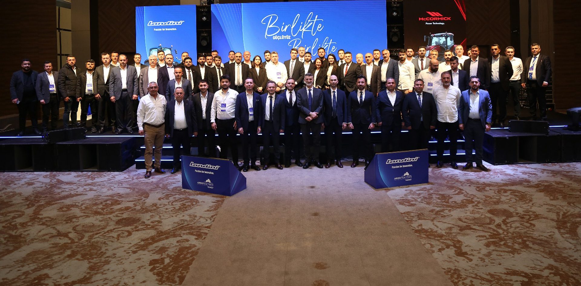 Formal wear, White-collar worker, Suit trousers, Event, Coat, Technology, Blazer, Logo