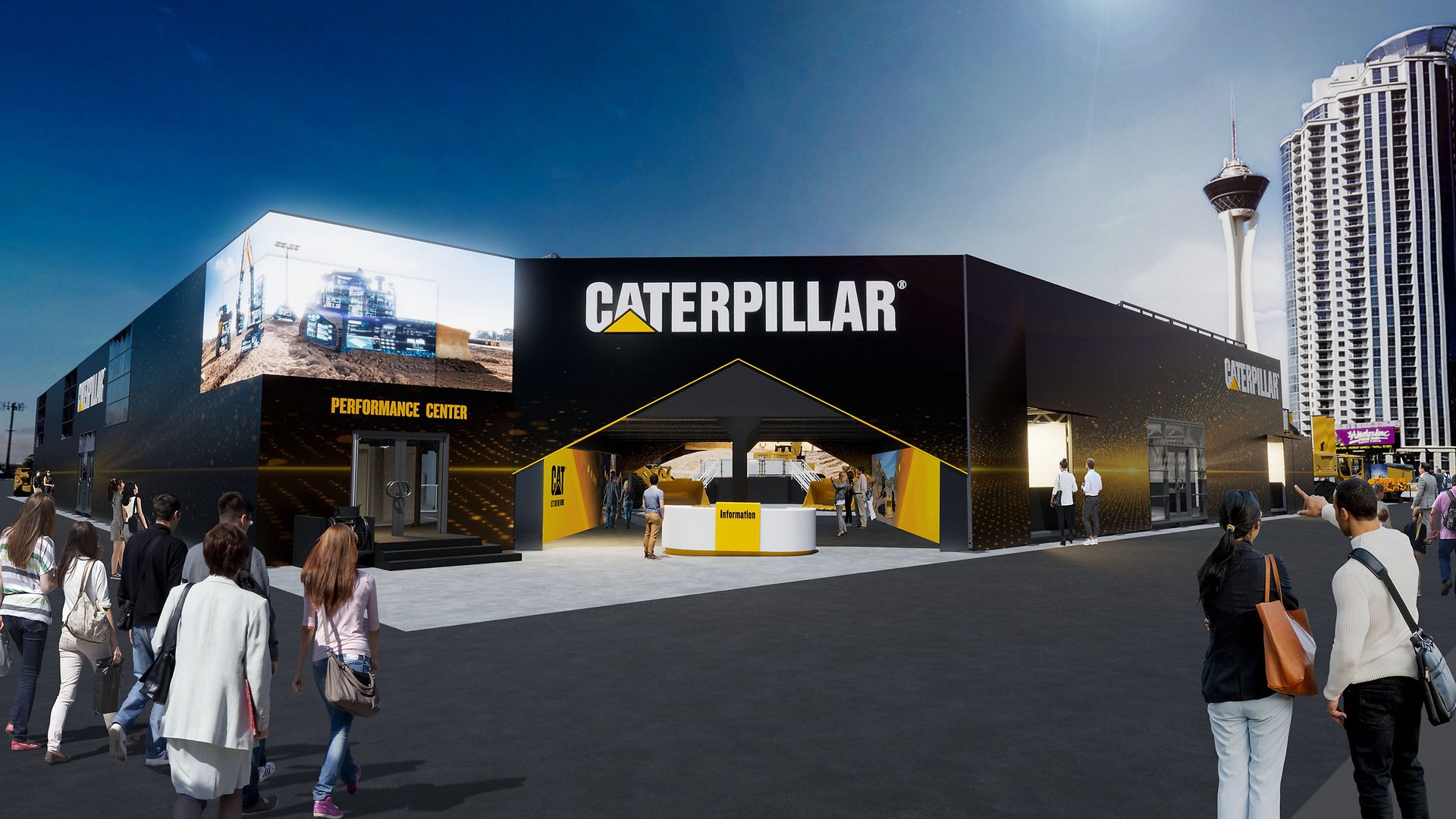 Caterpillar exhibit building, black with yellow logo, "Performance Center," people, Las Vegas skyline.