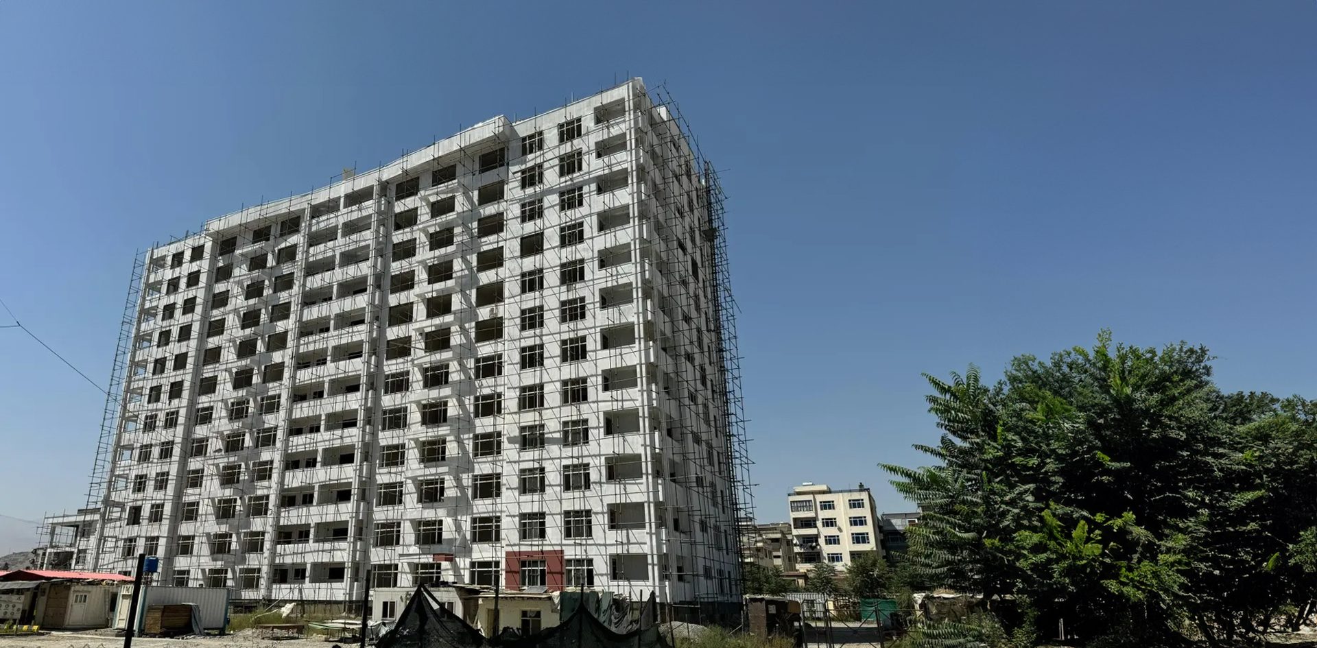 Urban design, Tower block, Sky, Building, Plant, Window, Condominium, Tree, Skyscraper