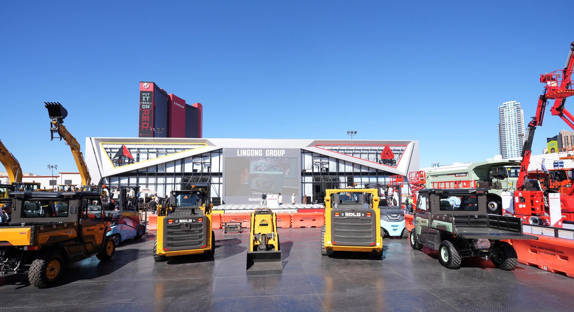 Lingong Group construction equipment display featuring skid steers and utility vehicles.