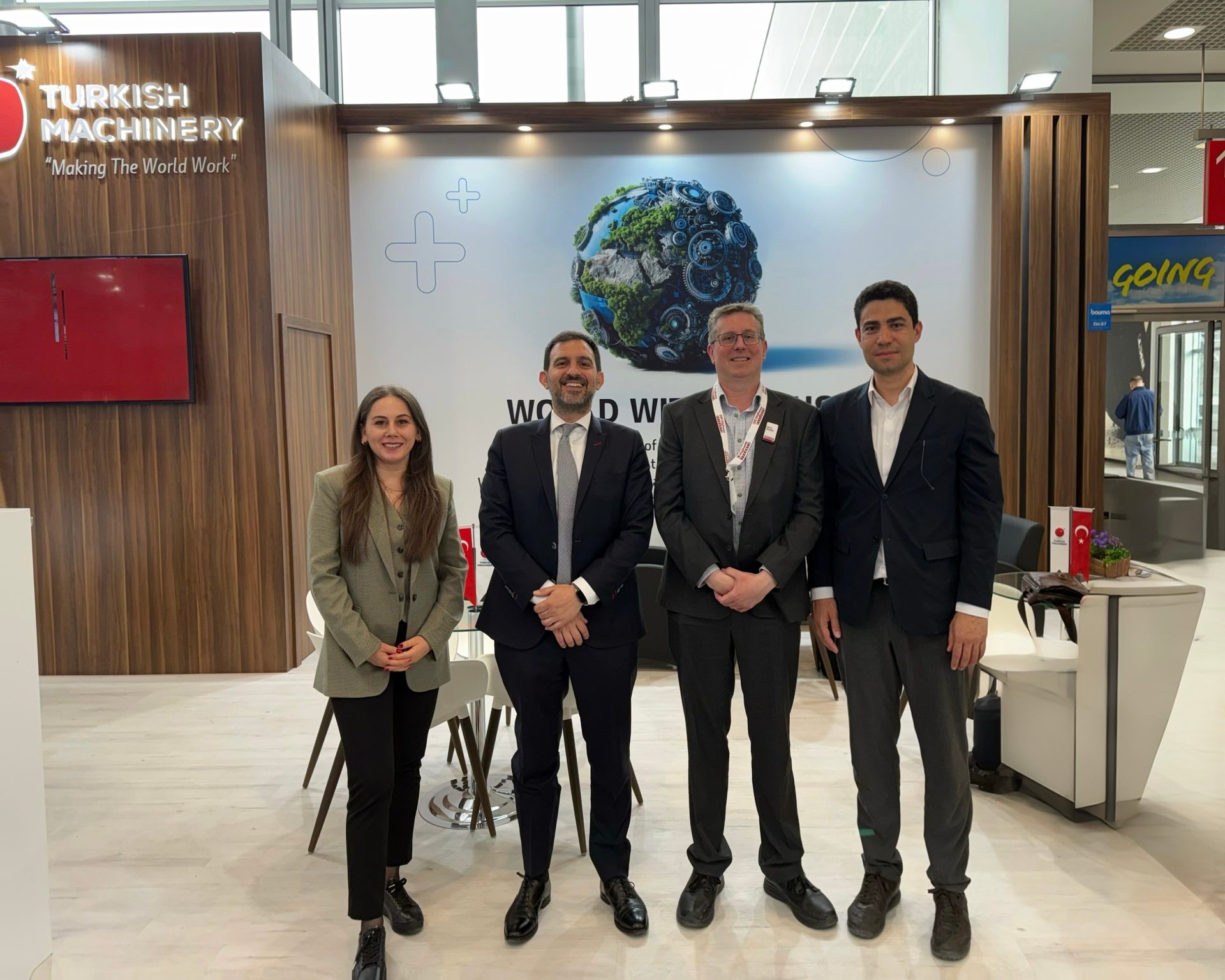 Interior design, White-collar worker, Suit trousers, Clothing, Outerwear, Coat, Smile, Necktie