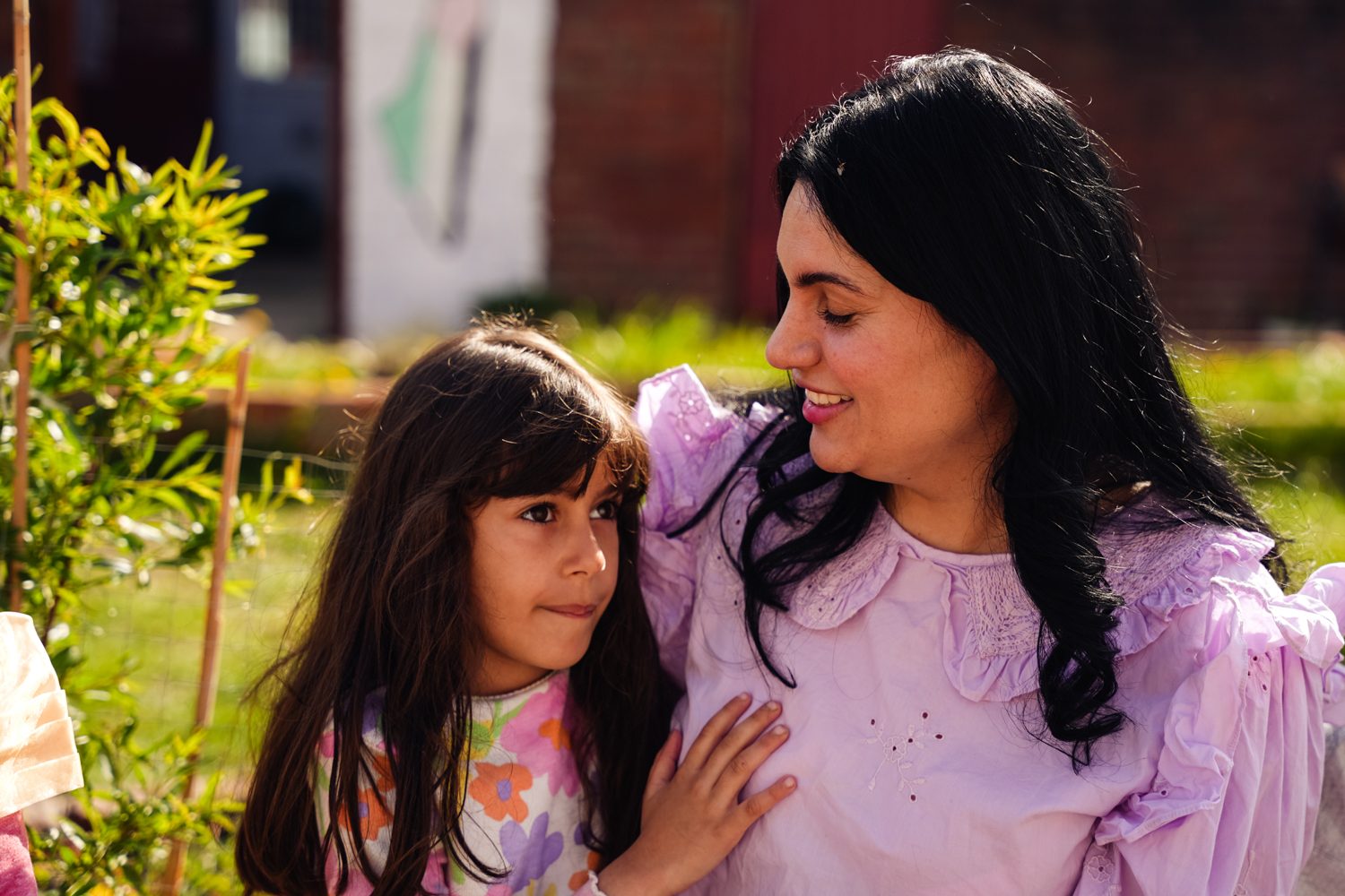 Photo of lady and her young daughter hugging