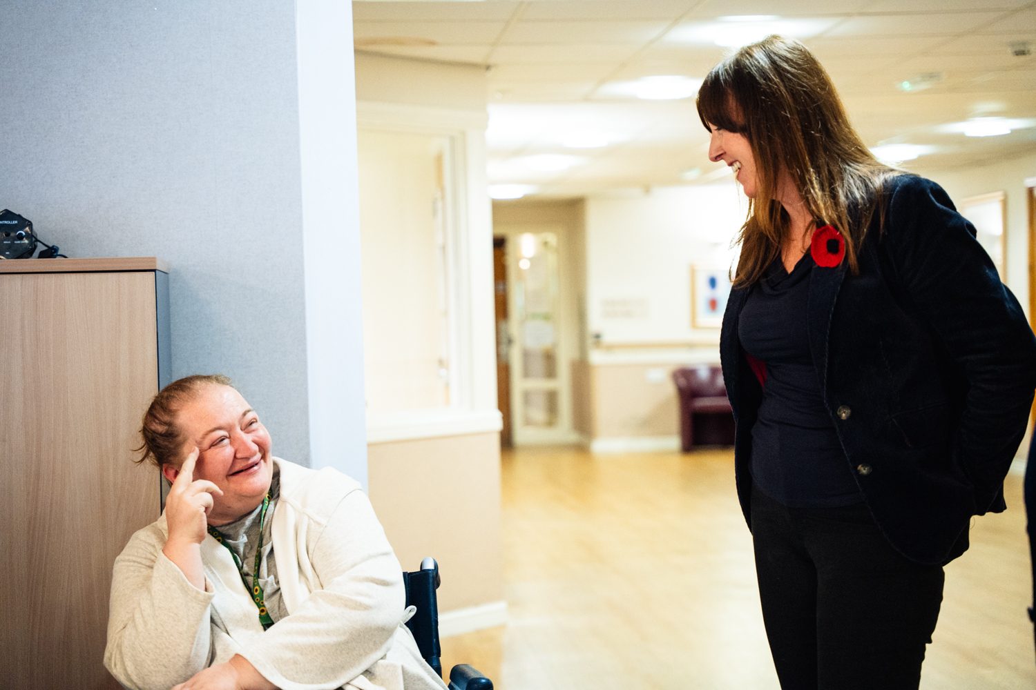 Chief exec, Charlie Norman chatting to resident