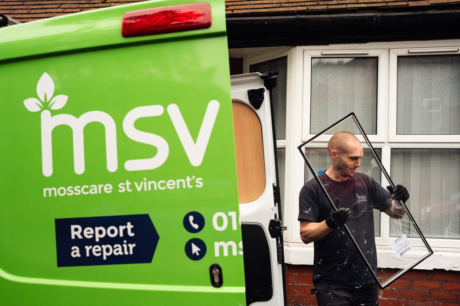 MSV staff member getting a piece of glass out of an msv van