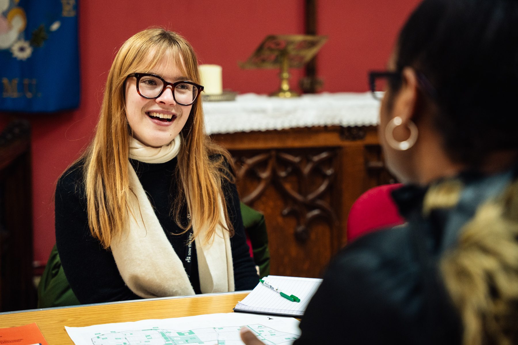 photo of lady smiling and talking to customer