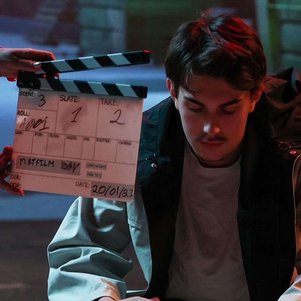 Clapperboard displaying "METFILM DAY" and 20/01/23, next to a young man.