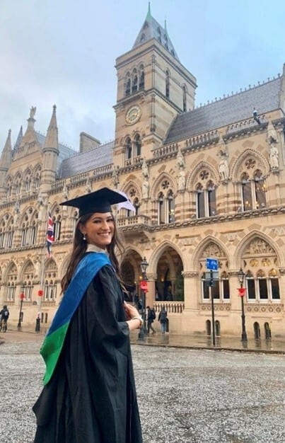 Academic dress, Sky, Cloud, Building, Window, Smile, Mortarboard, Travel, Graduation, Clock