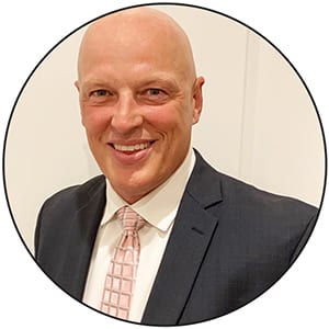 Dress shirt, Forehead, Smile, Chin, Tie, Dishware, Jaw, Coat, Gesture, Collar