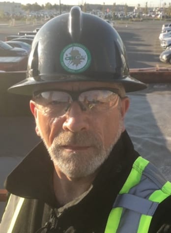 Hard hat, High-visibility clothing, Motor vehicle, Baseball cap, Glasses, Helmet, Workwear, Beard