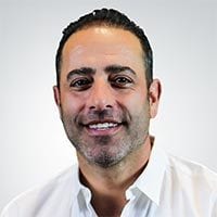 Dress shirt, Forehead, Nose, Smile, Beard, Jaw, Eyelash, Neck, Ear, Gesture