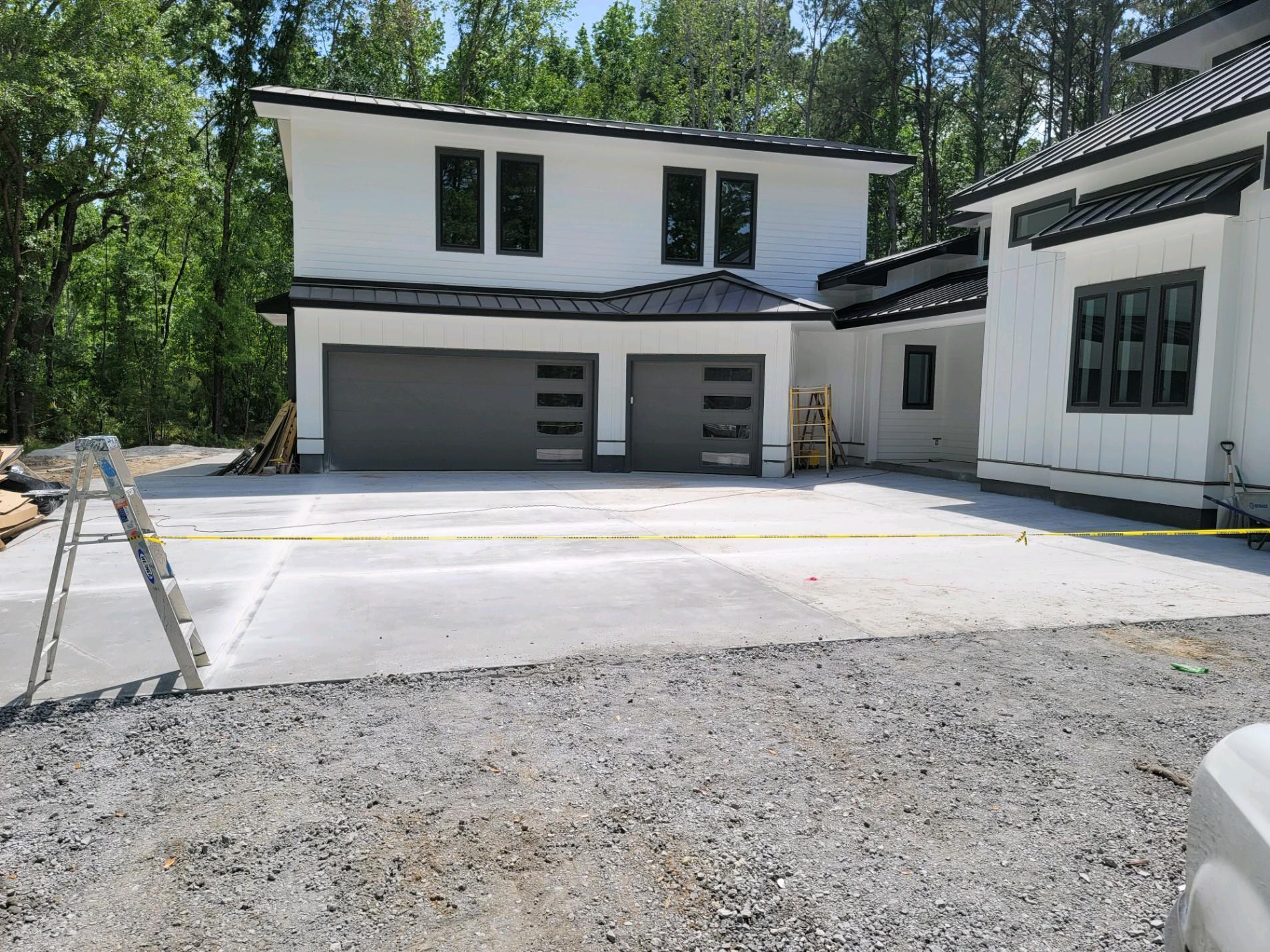Road surface, Garage door, Land lot, Window, Building, Sky, Tree, Asphalt, House