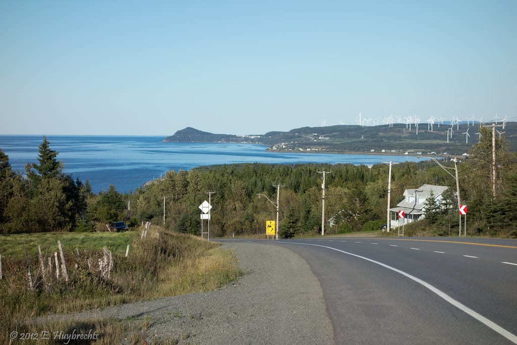 Road surface, Land lot, Natural landscape, Water, Sky, Plant, Tree, Highland, Asphalt